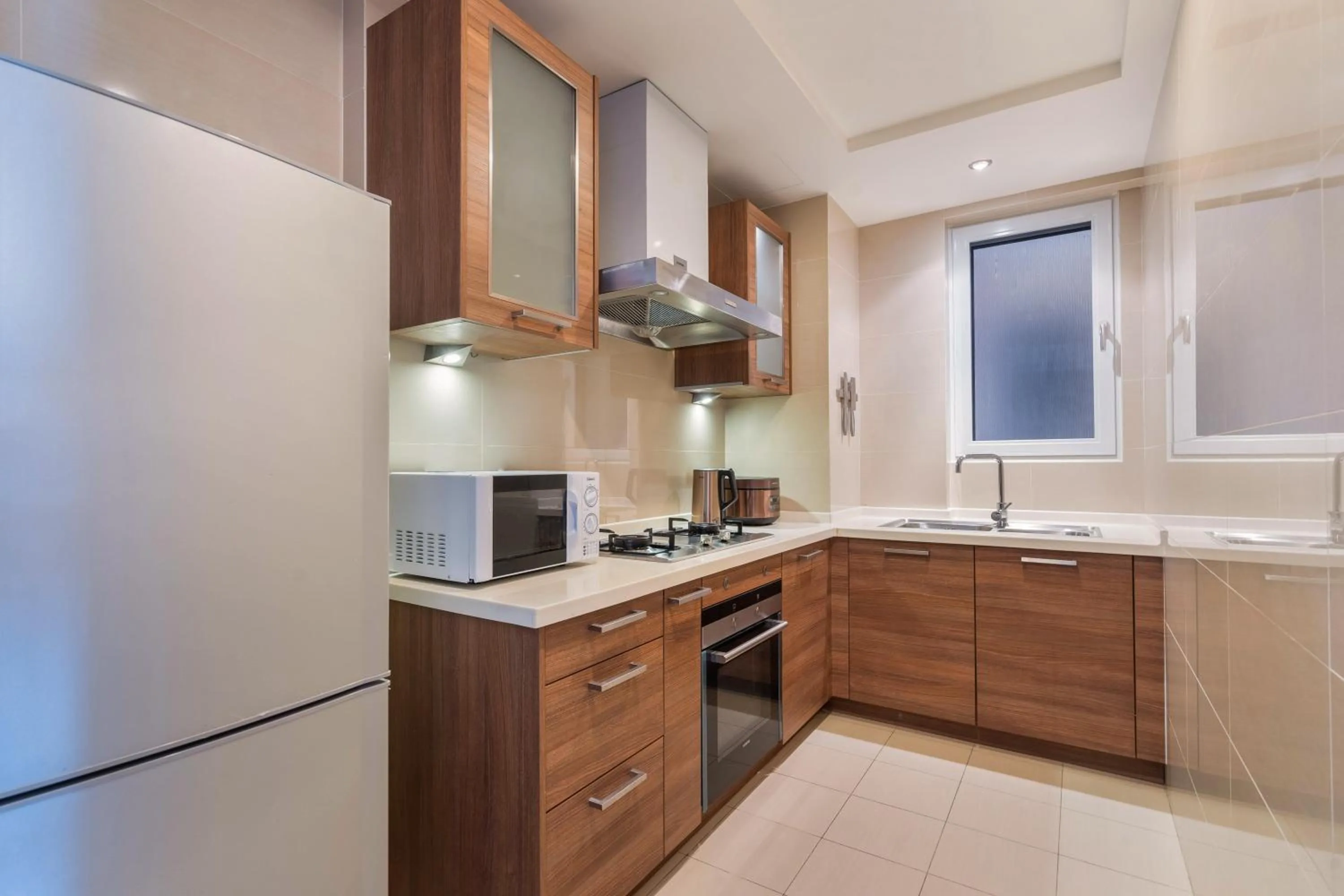 Kitchen or kitchenette in Sanya Yikehai View Apartments