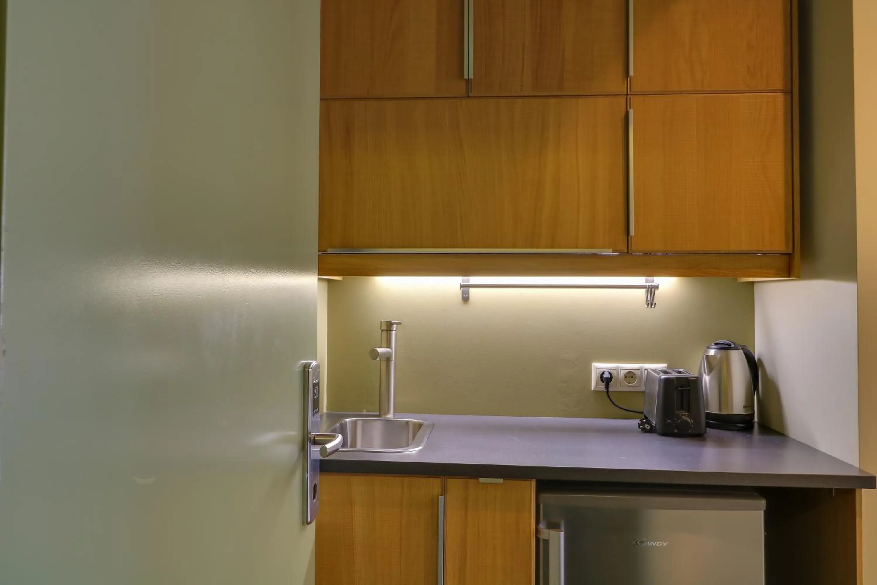 Kitchen or kitchenette in Elite Ermou Suites