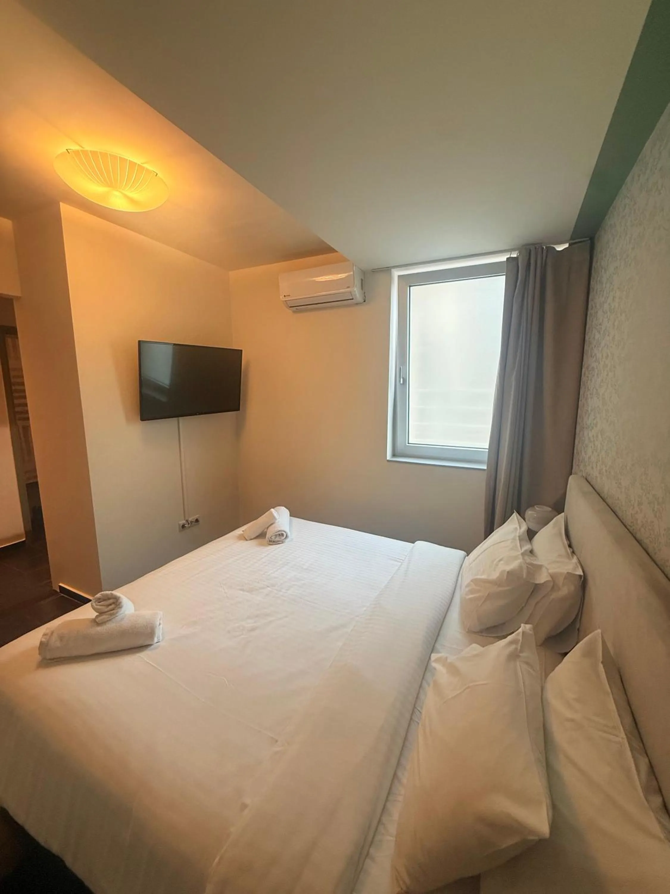 Bed in Elite Ermou Suites