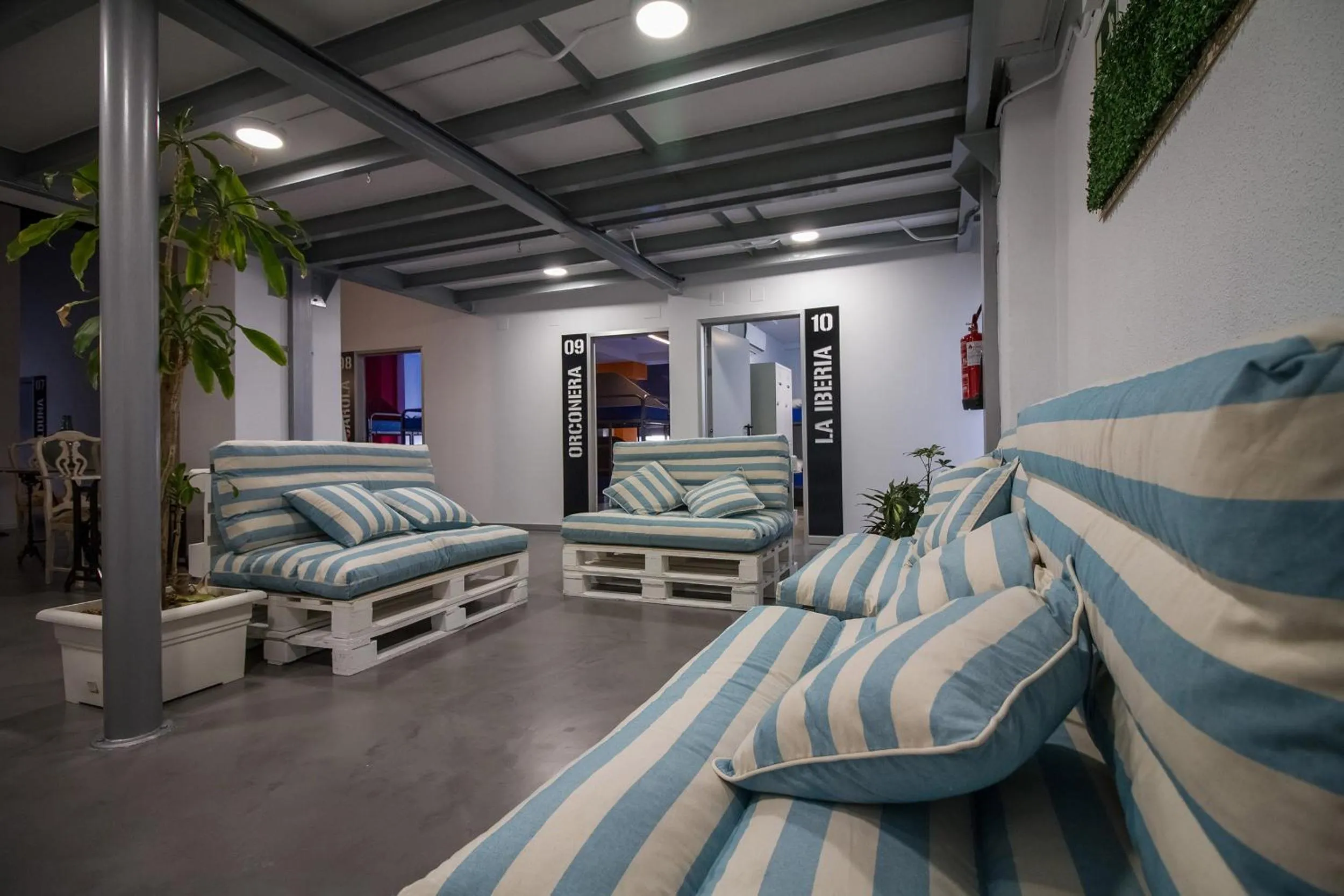 Communal lounge/ TV room in All Iron Hostel