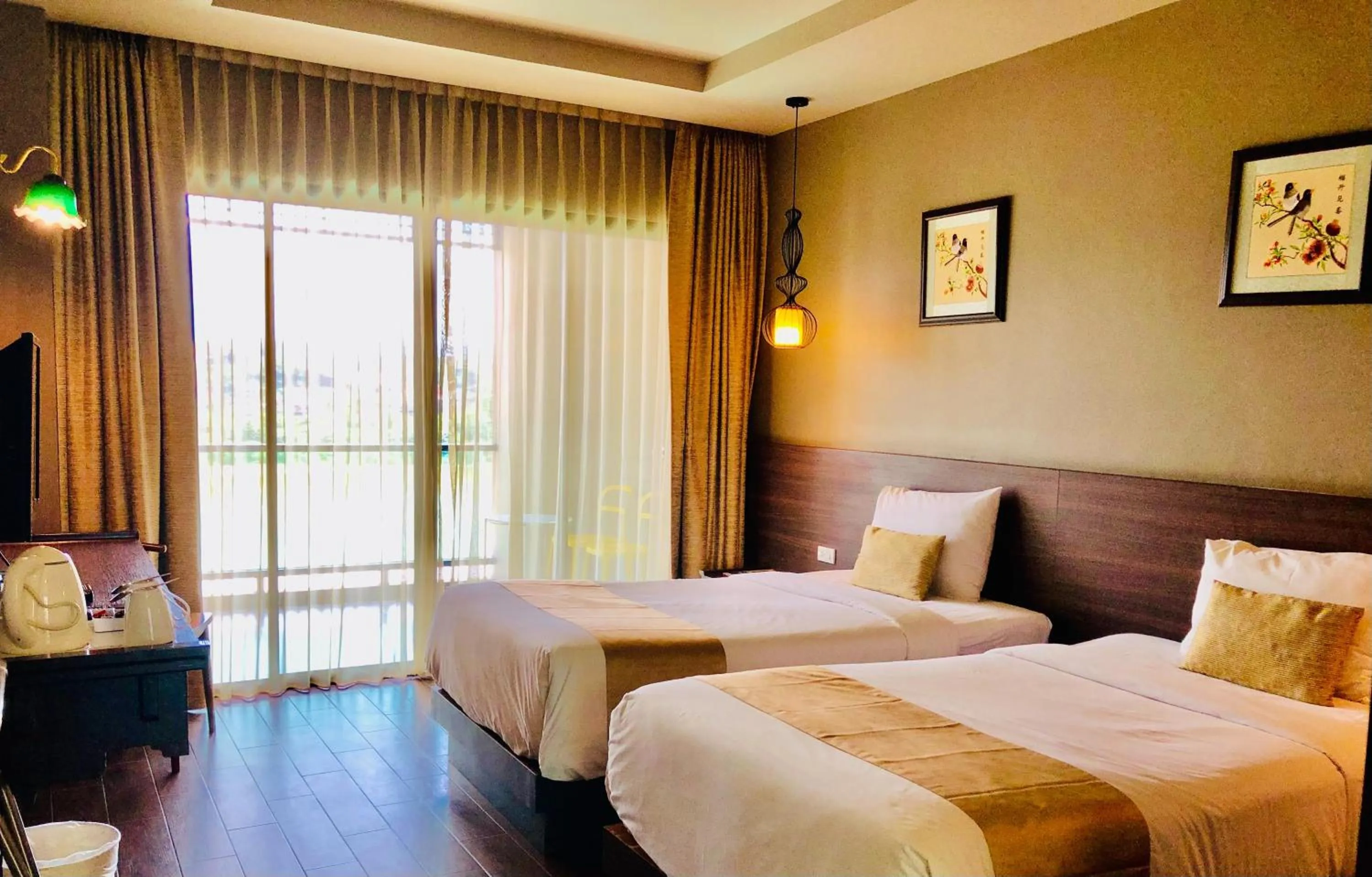 Bed in Chiangkhong Teak Garden Riverfront Onsen Hotel- SHA Extra Plus
