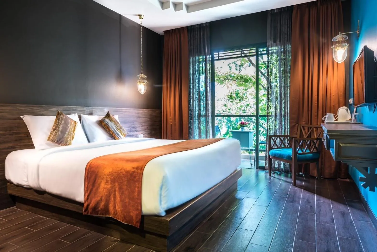 Bed in Chiangkhong Teak Garden Riverfront Onsen Hotel- SHA Extra Plus