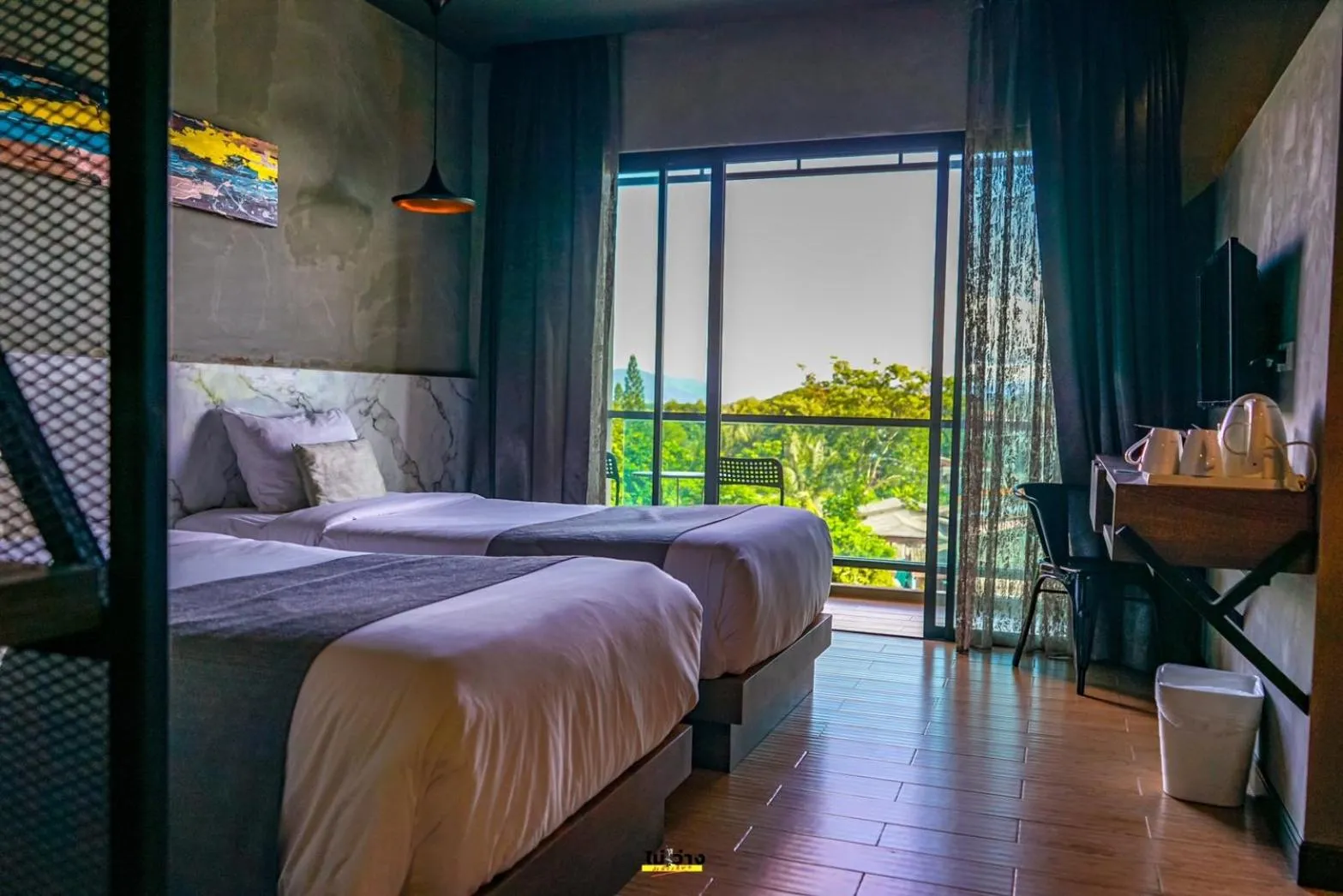 Bed in Chiangkhong Teak Garden Riverfront Onsen Hotel- SHA Extra Plus