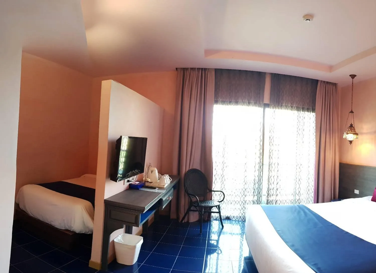 Bed in Chiangkhong Teak Garden Riverfront Onsen Hotel- SHA Extra Plus