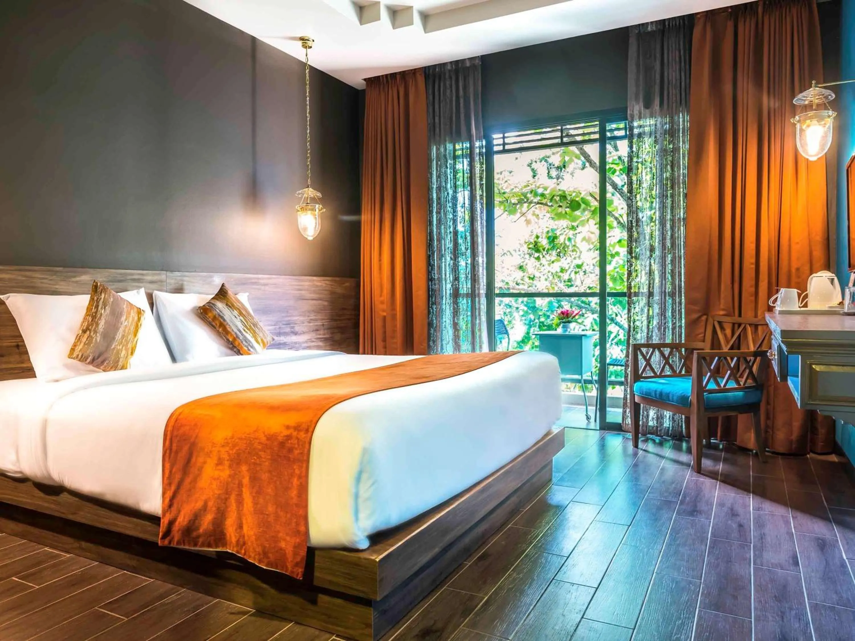 Photo of the whole room, Bed in Chiangkhong Teak Garden Riverfront Onsen Hotel- SHA Extra Plus