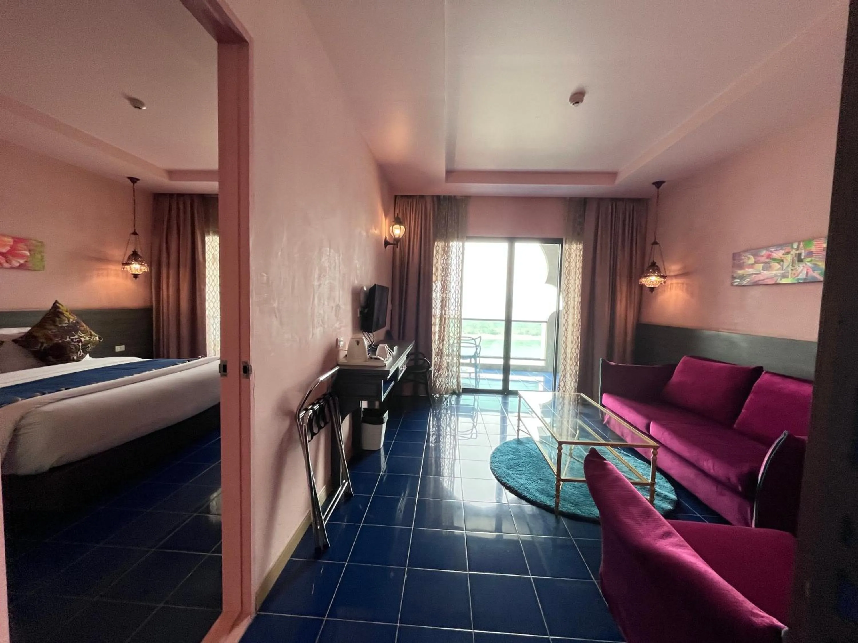 Bed in Chiangkhong Teak Garden Riverfront Onsen Hotel- SHA Extra Plus