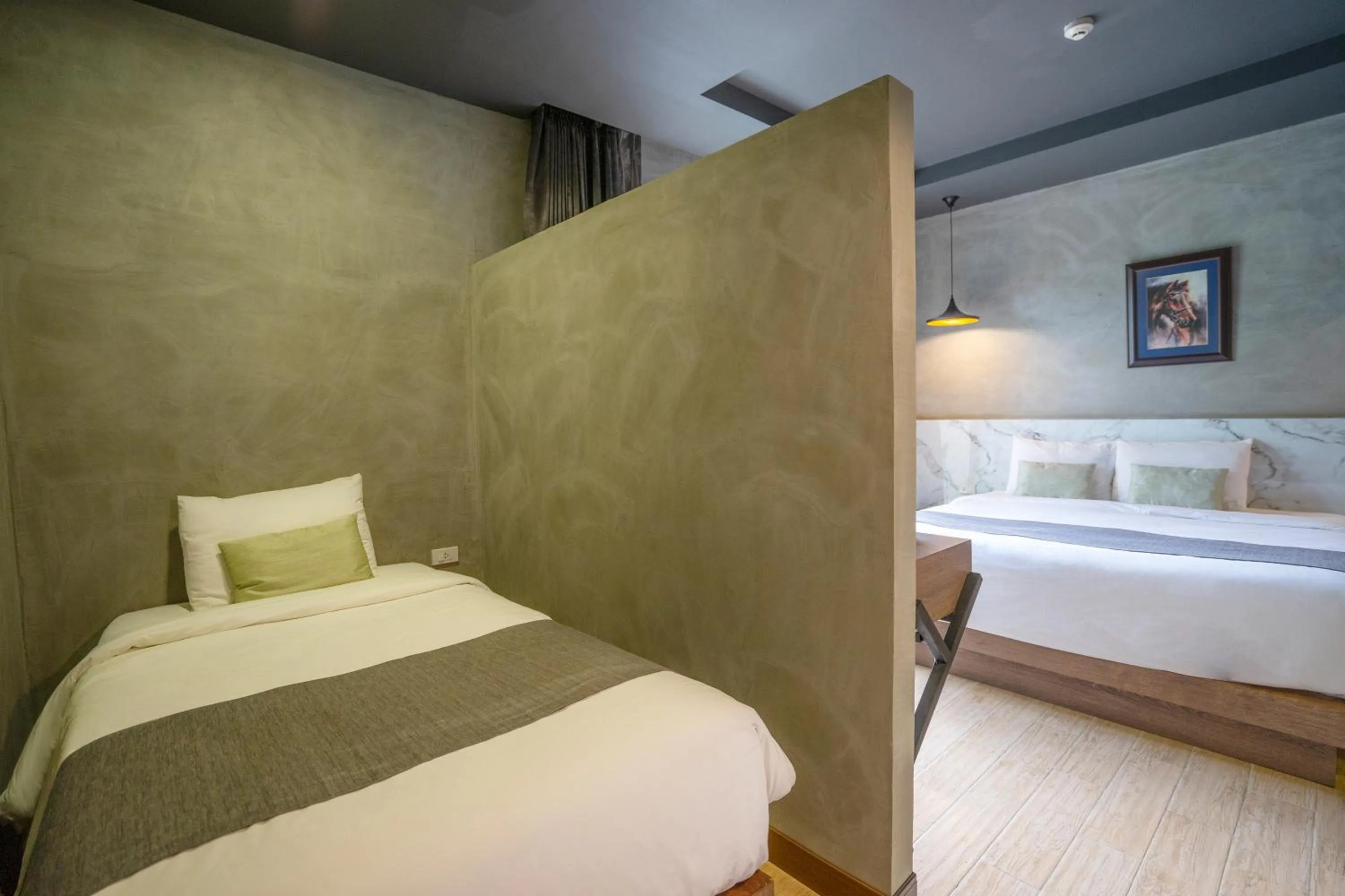 Bed in Chiangkhong Teak Garden Riverfront Onsen Hotel- SHA Extra Plus