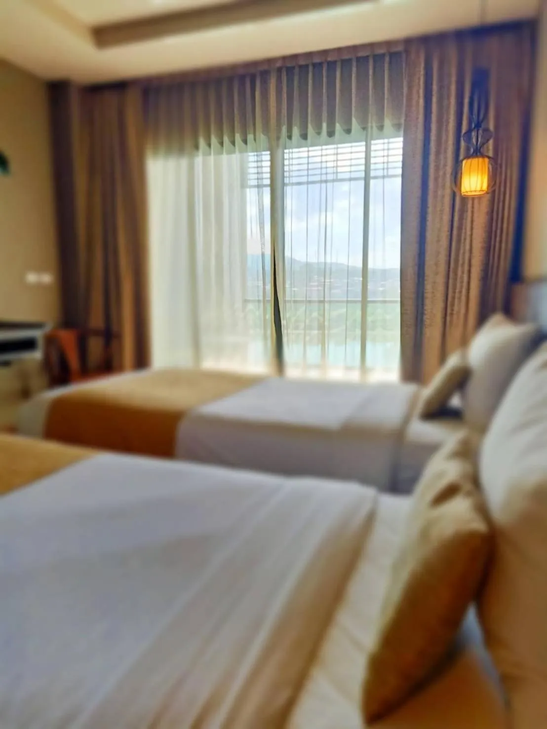 Bed in Chiangkhong Teak Garden Riverfront Onsen Hotel- SHA Extra Plus