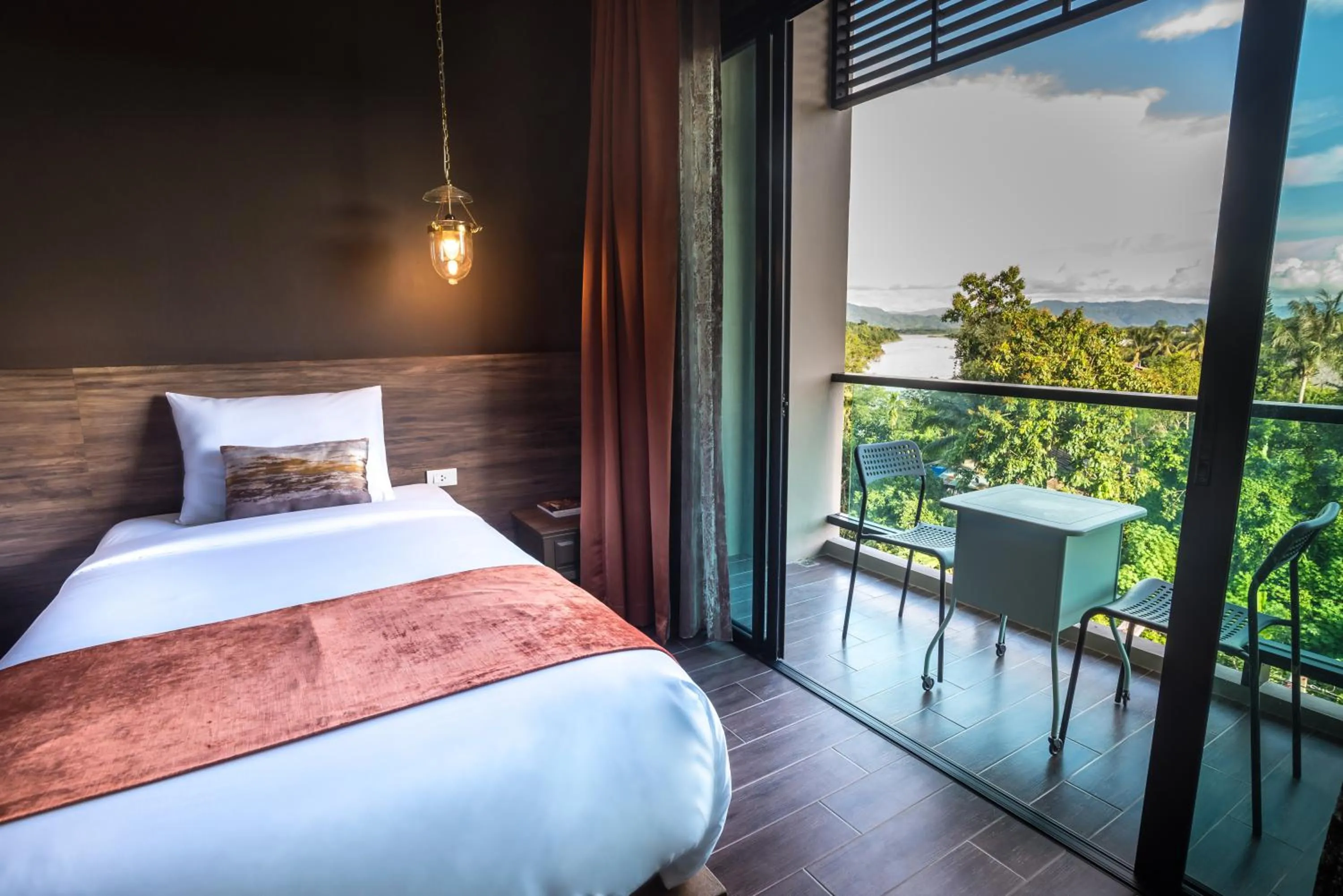 Photo of the whole room, Bed in Chiangkhong Teak Garden Riverfront Onsen Hotel- SHA Extra Plus