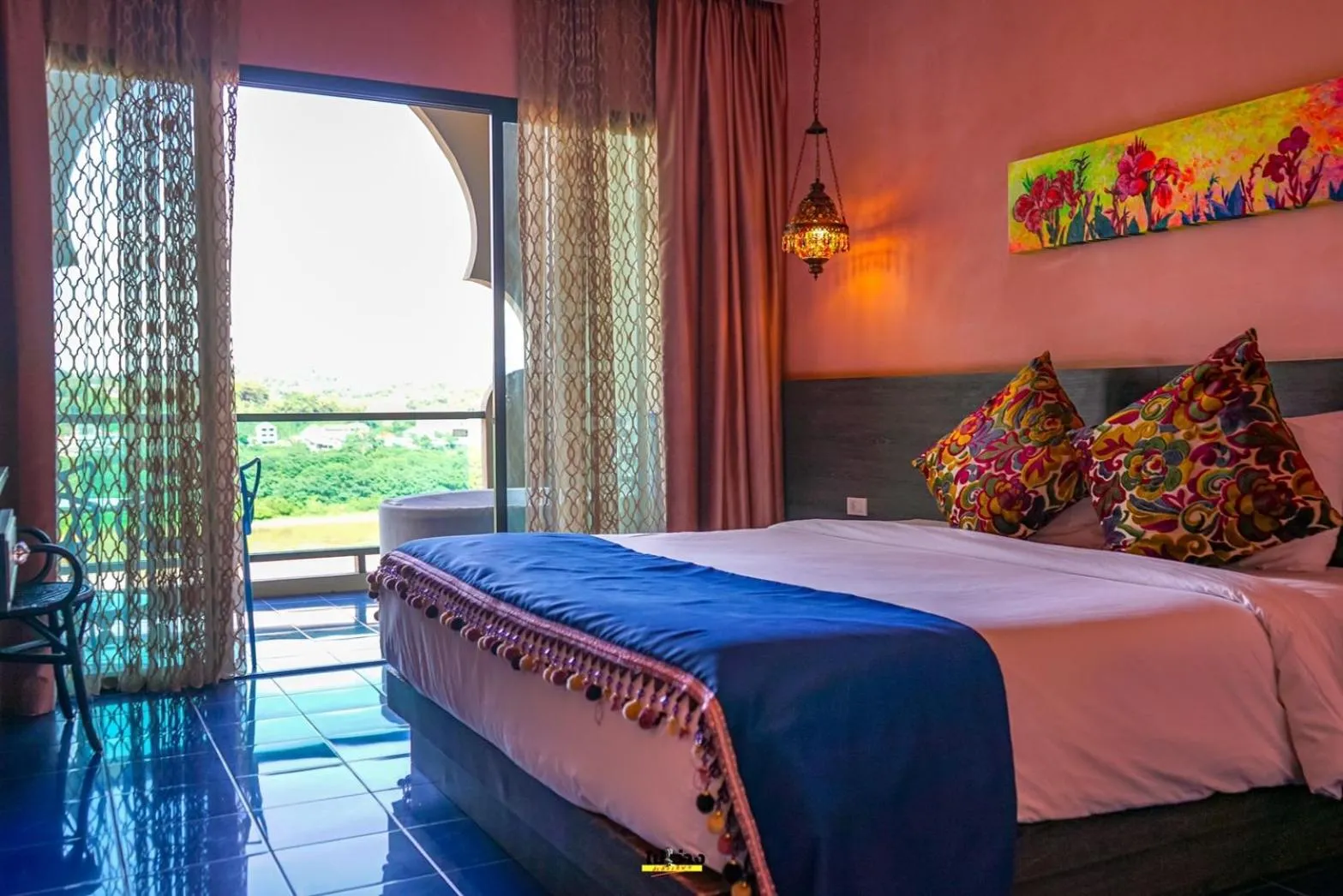 Bed in Chiangkhong Teak Garden Riverfront Onsen Hotel- SHA Extra Plus