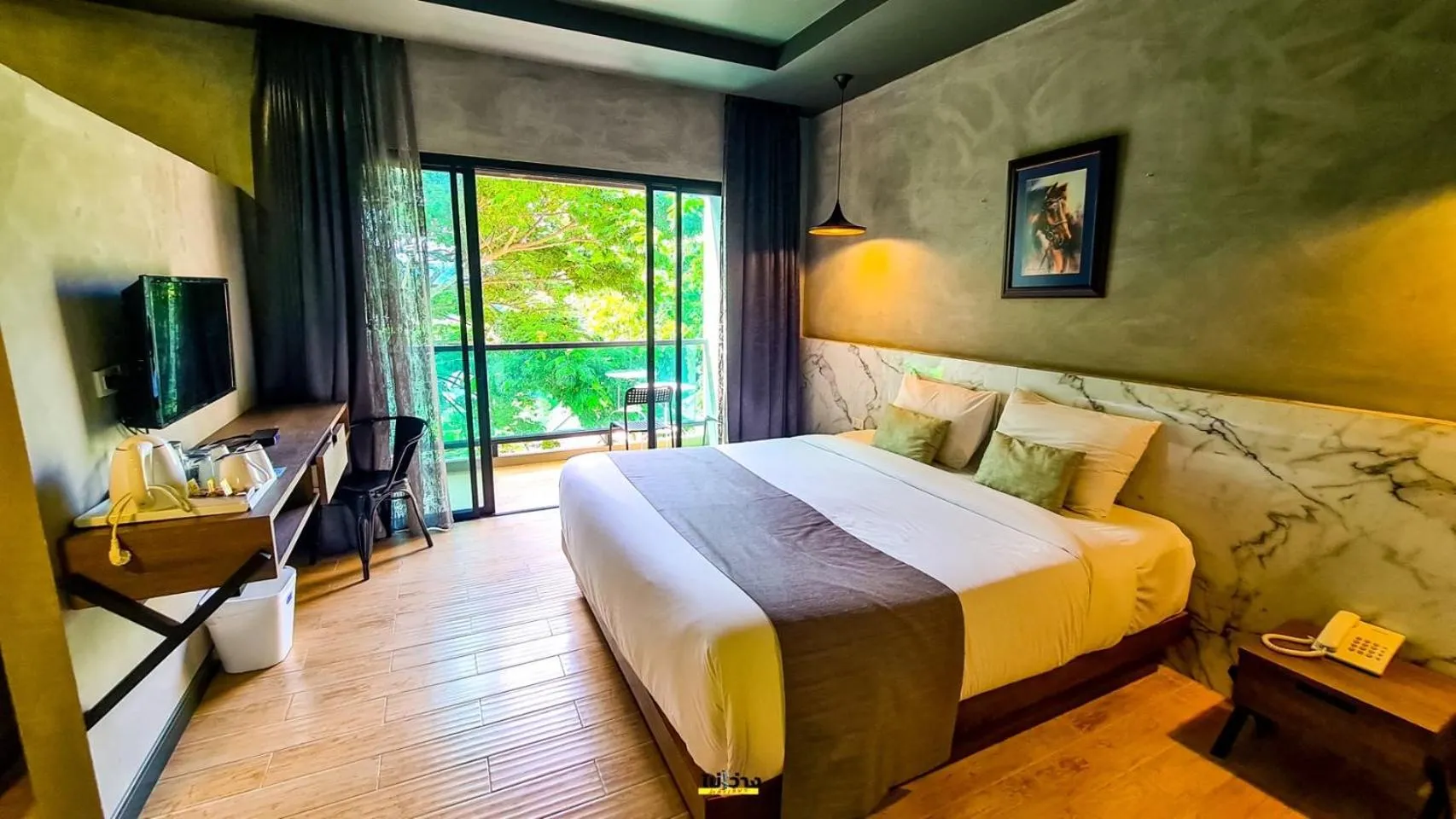 Bed in Chiangkhong Teak Garden Riverfront Onsen Hotel- SHA Extra Plus
