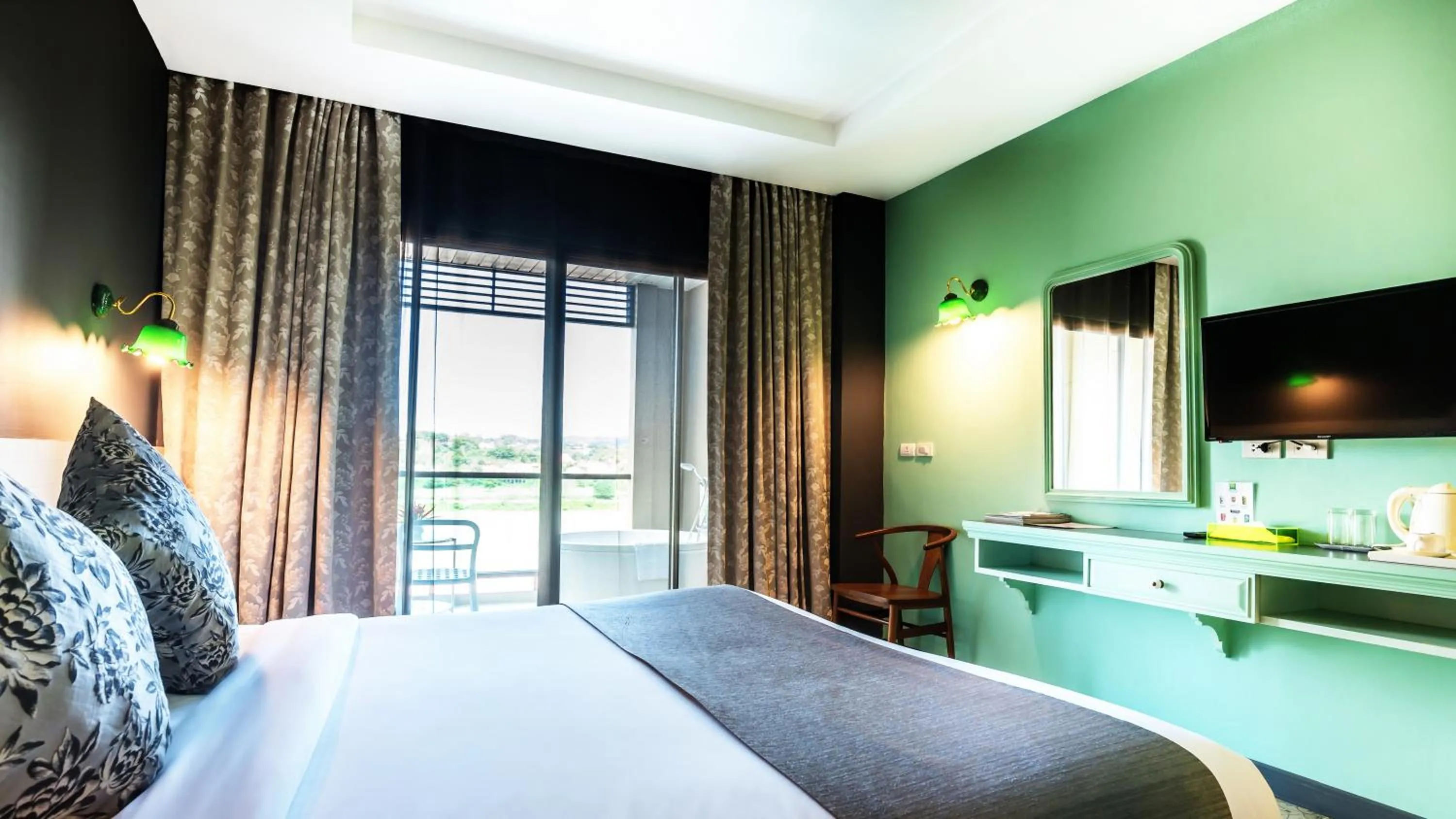 Bed in Chiangkhong Teak Garden Riverfront Onsen Hotel- SHA Extra Plus