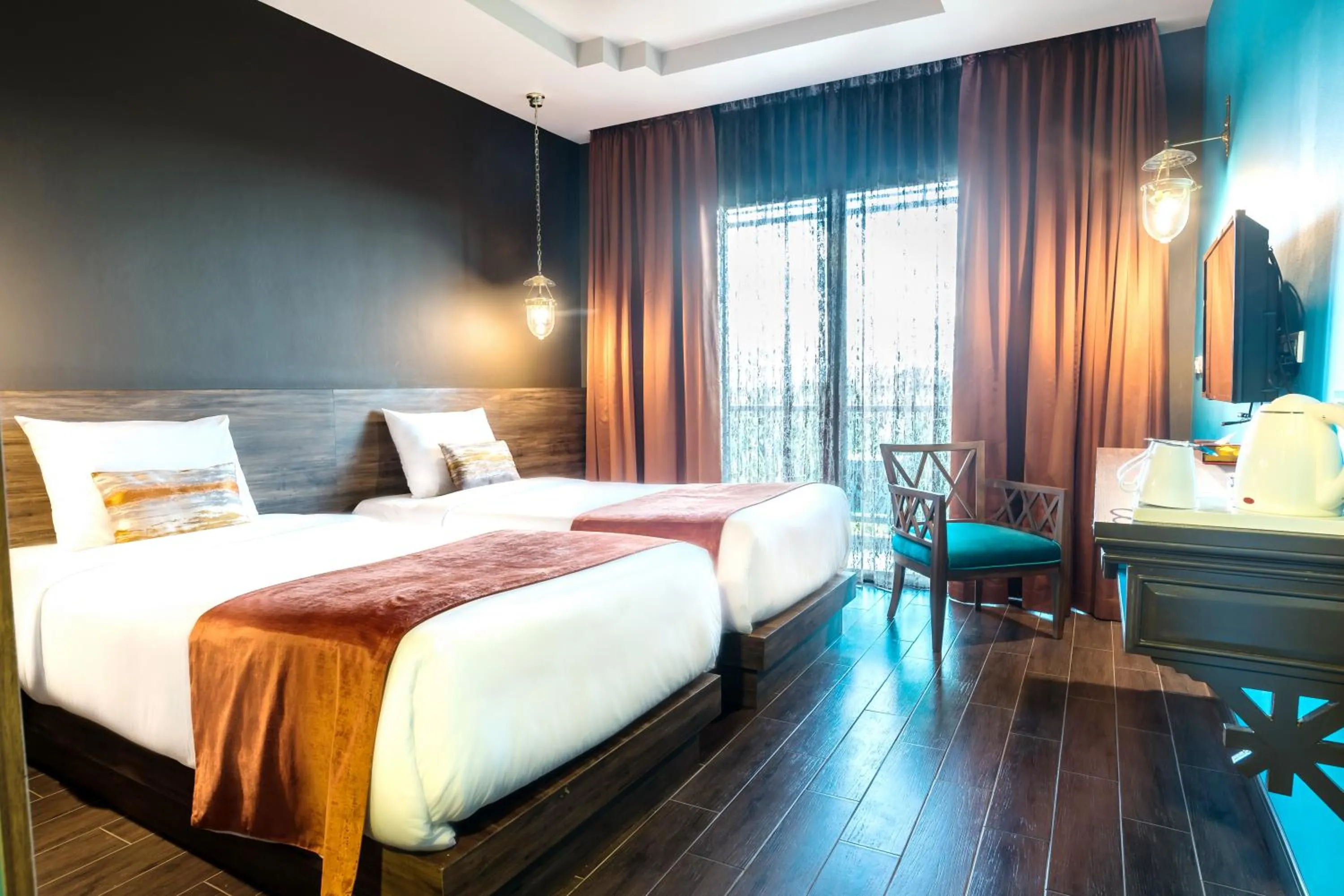 Bed in Chiangkhong Teak Garden Riverfront Onsen Hotel- SHA Extra Plus