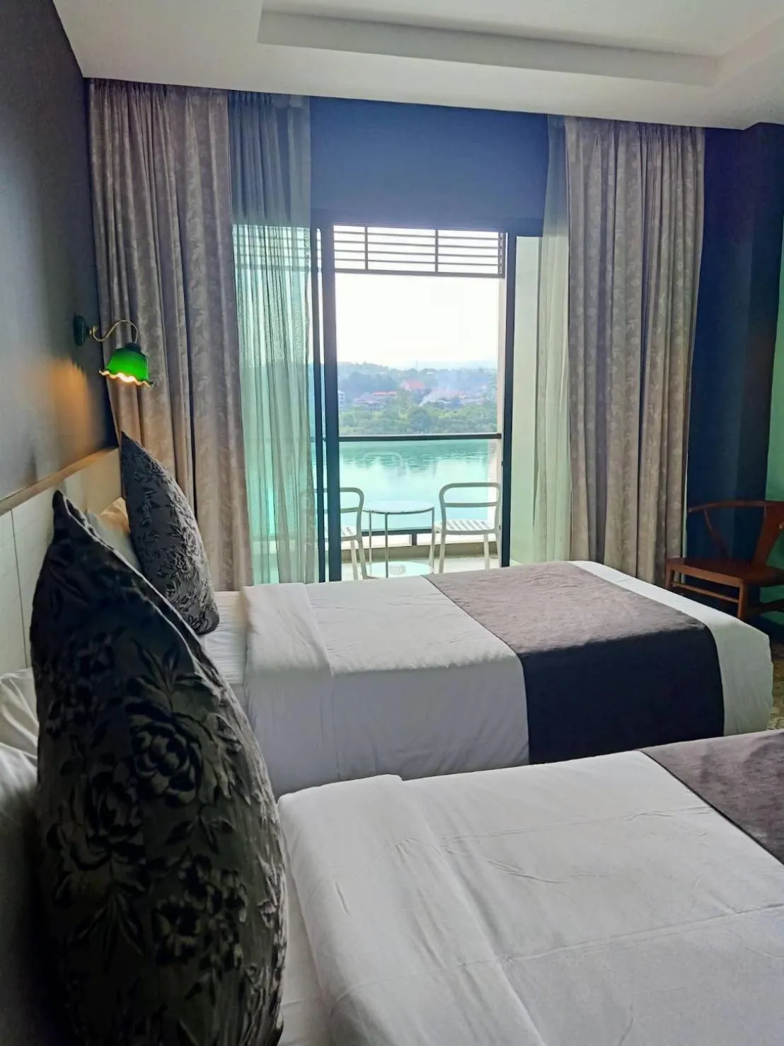 Bed in Chiangkhong Teak Garden Riverfront Onsen Hotel- SHA Extra Plus