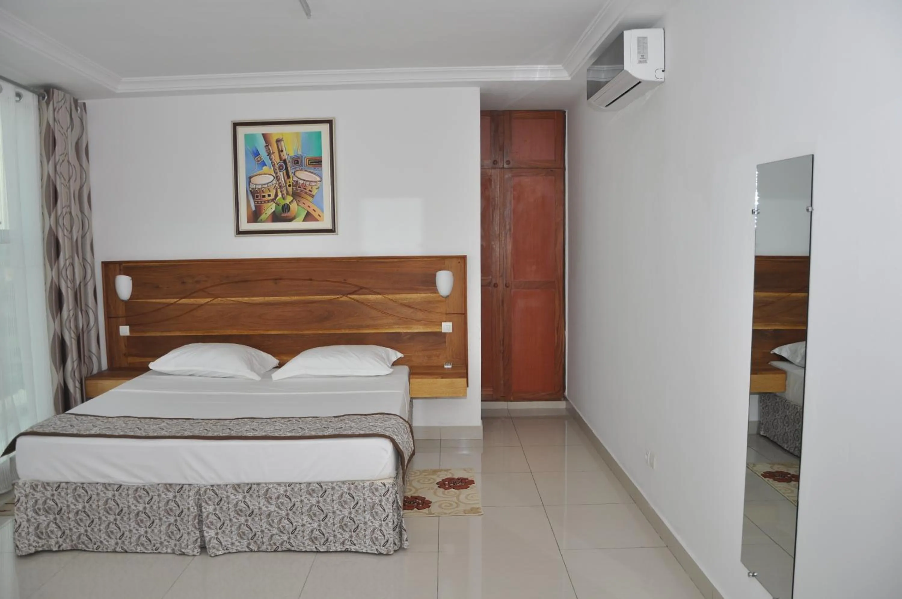 Bed in Rosalie's Suites