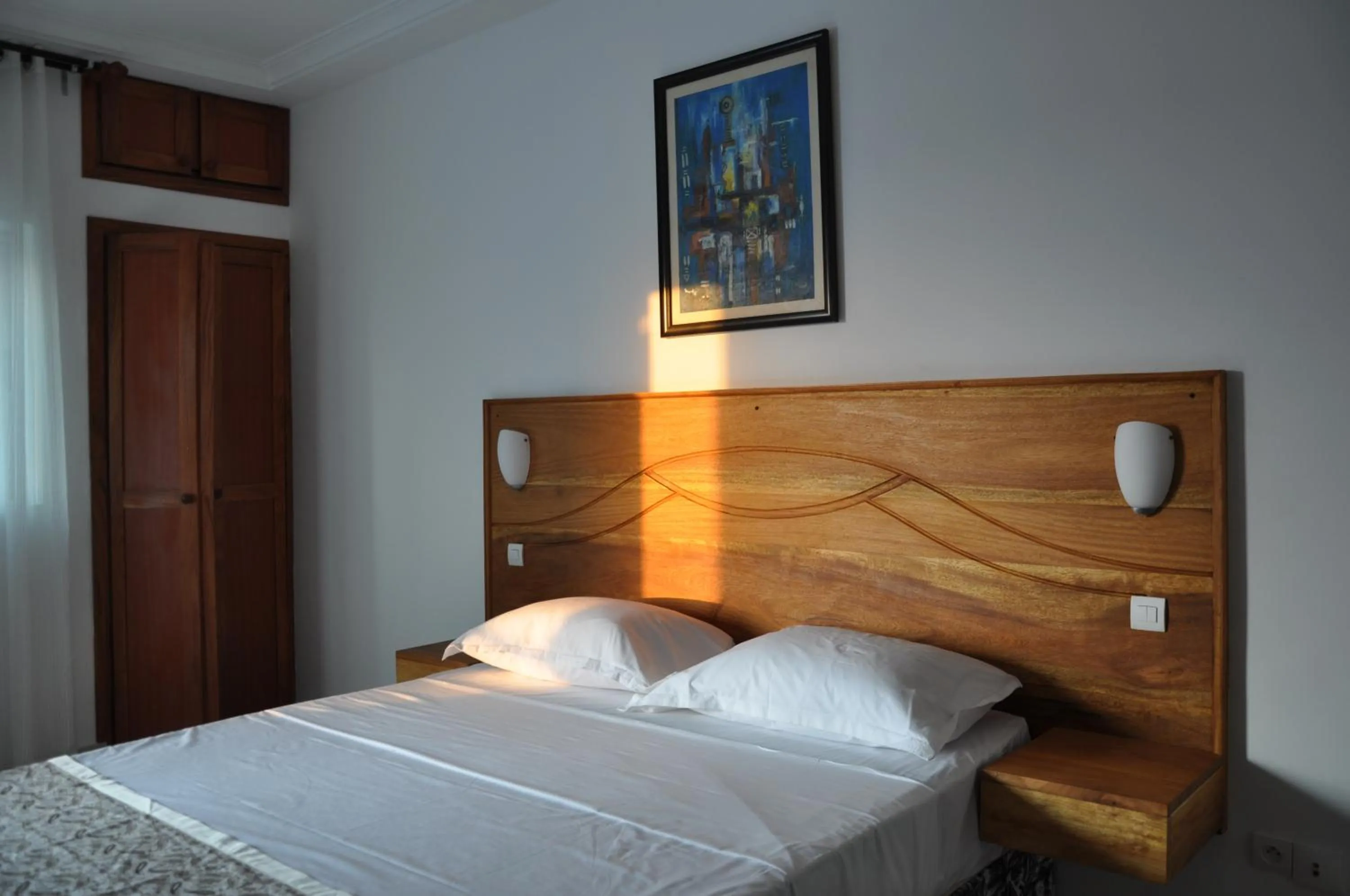 Bed in Rosalie's Suites