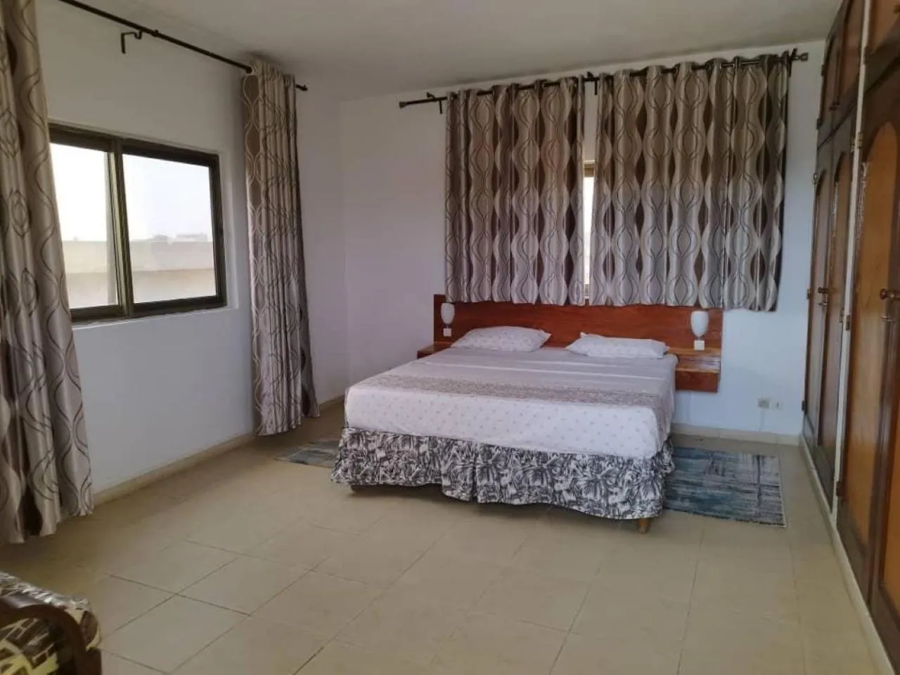 Bed in Rosalie's Suites