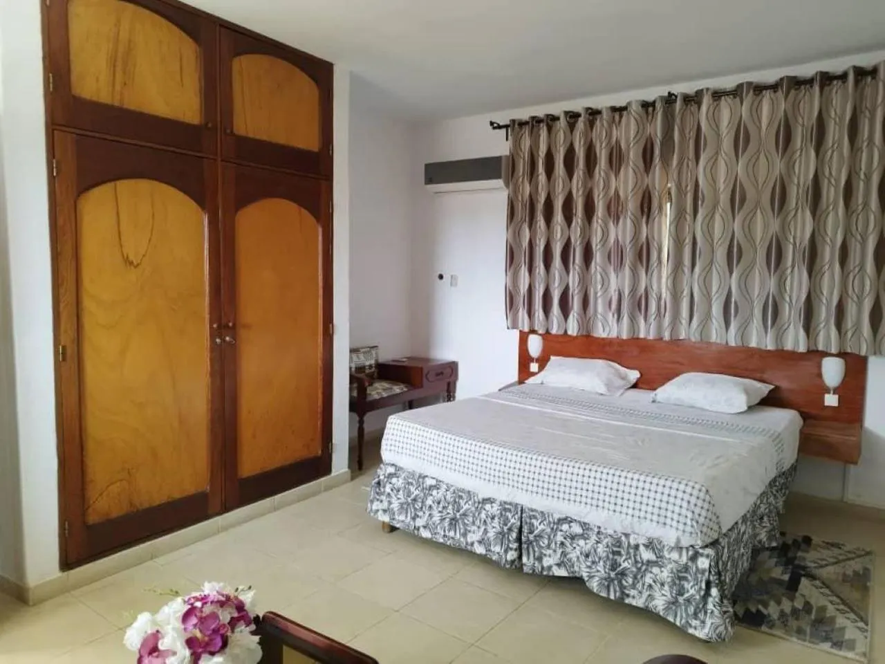 Bed in Rosalie's Suites