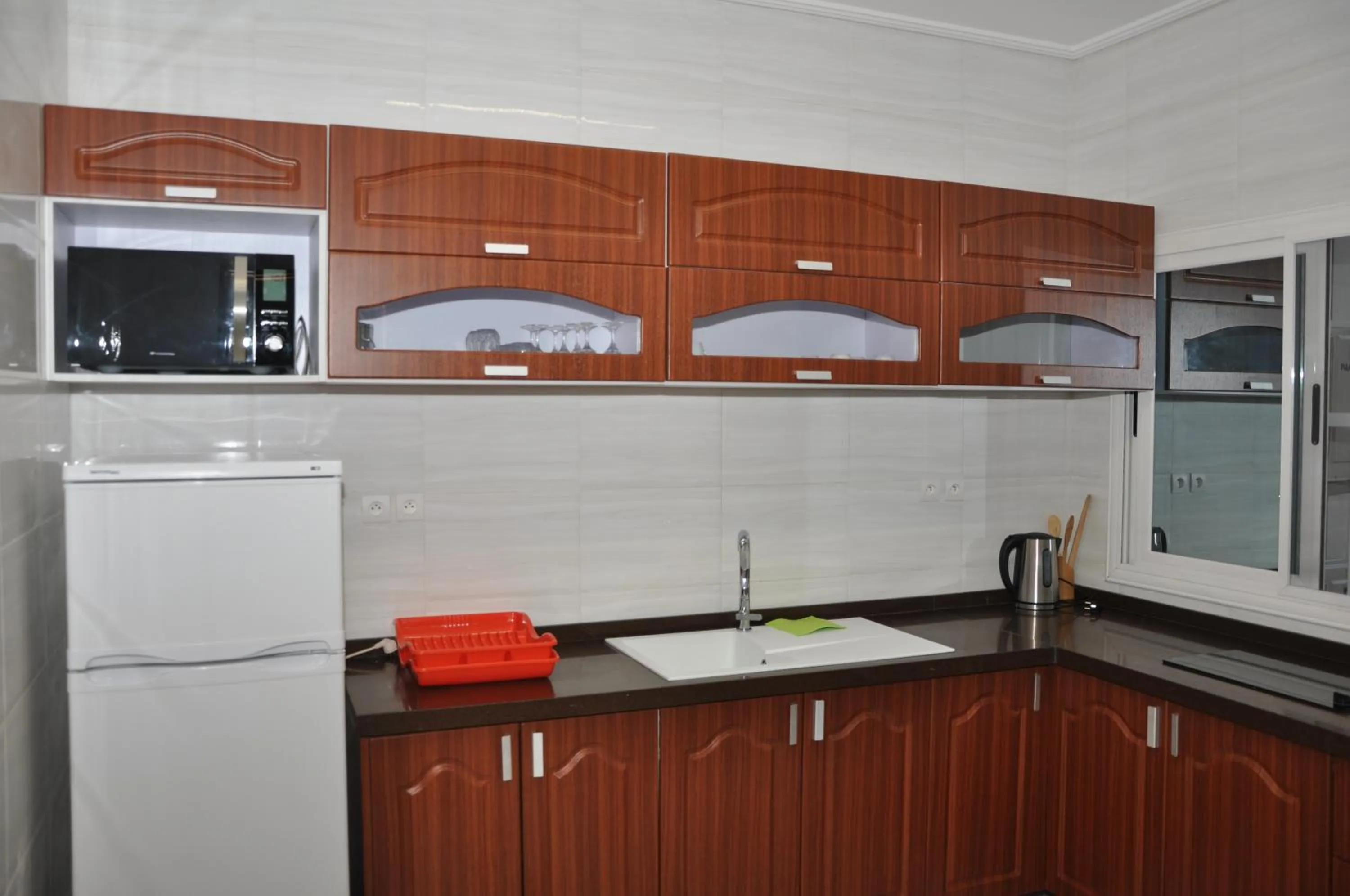 Kitchen or kitchenette in Rosalie's Suites