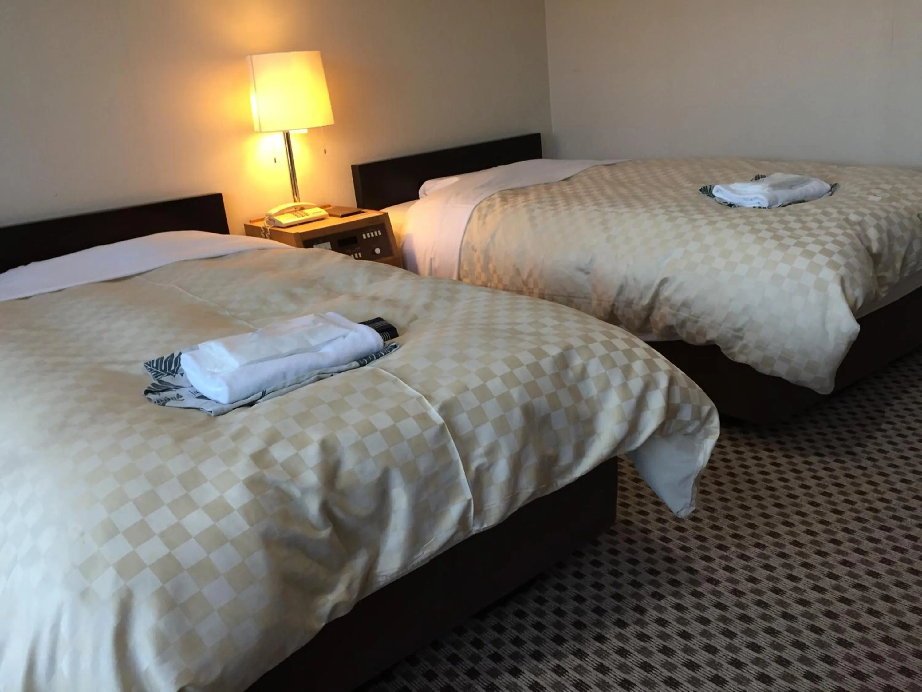 Bed in Hotel Kadoman