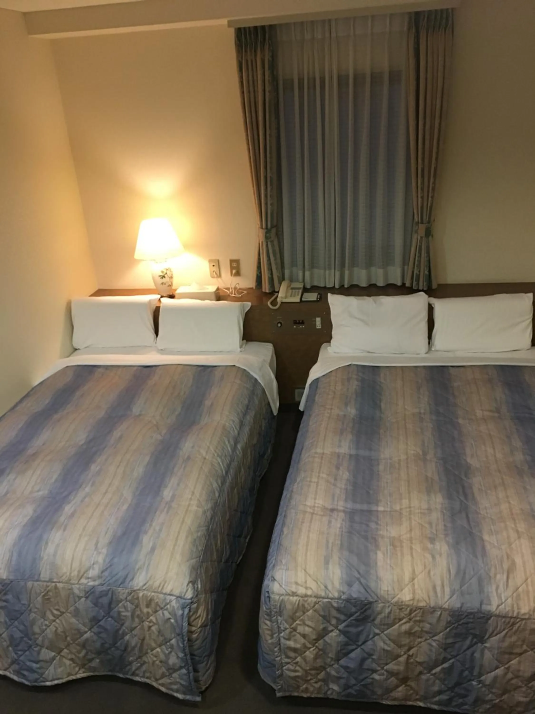 Photo of the whole room, Bed in Hotel Crown Hills Matsuyama