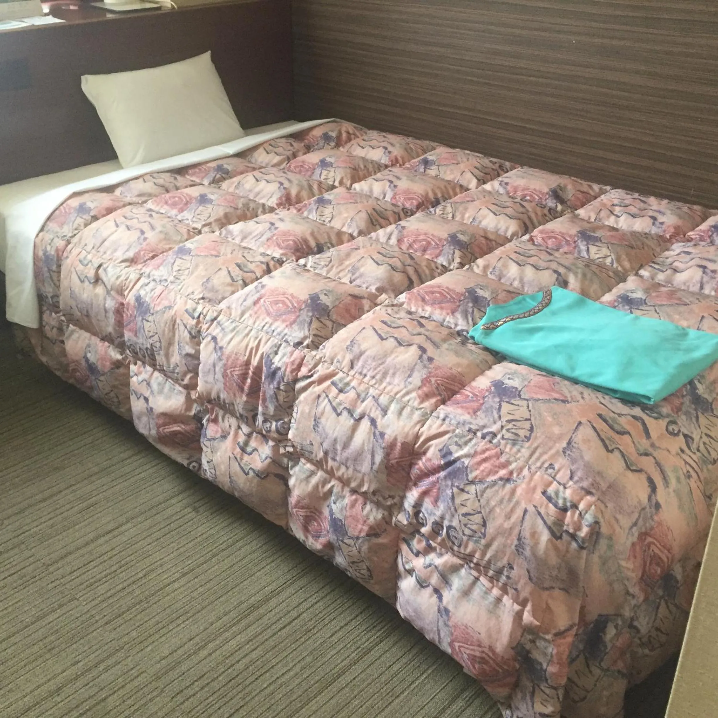 Bed in Hotel Niihama Hills