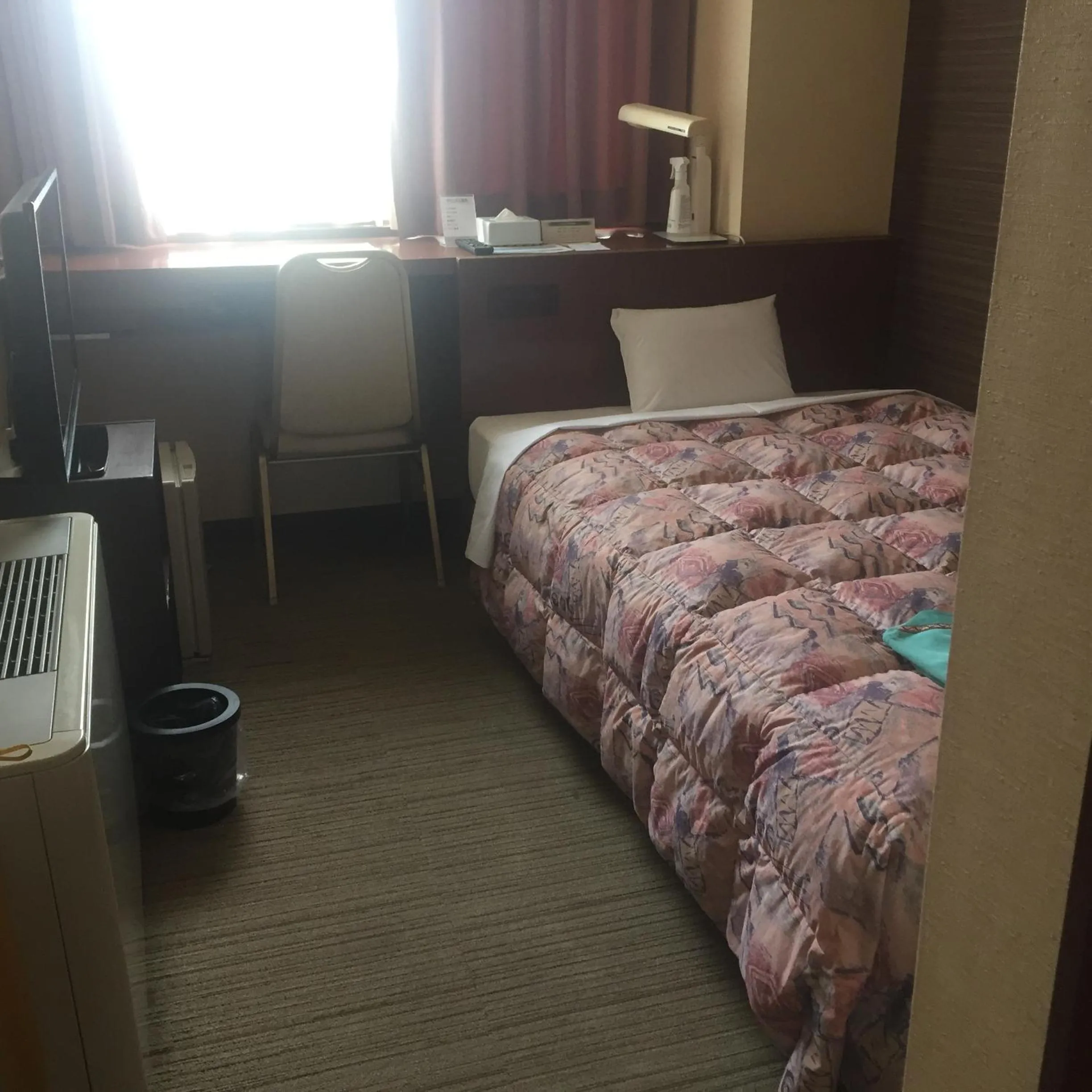 Bed in Hotel Niihama Hills