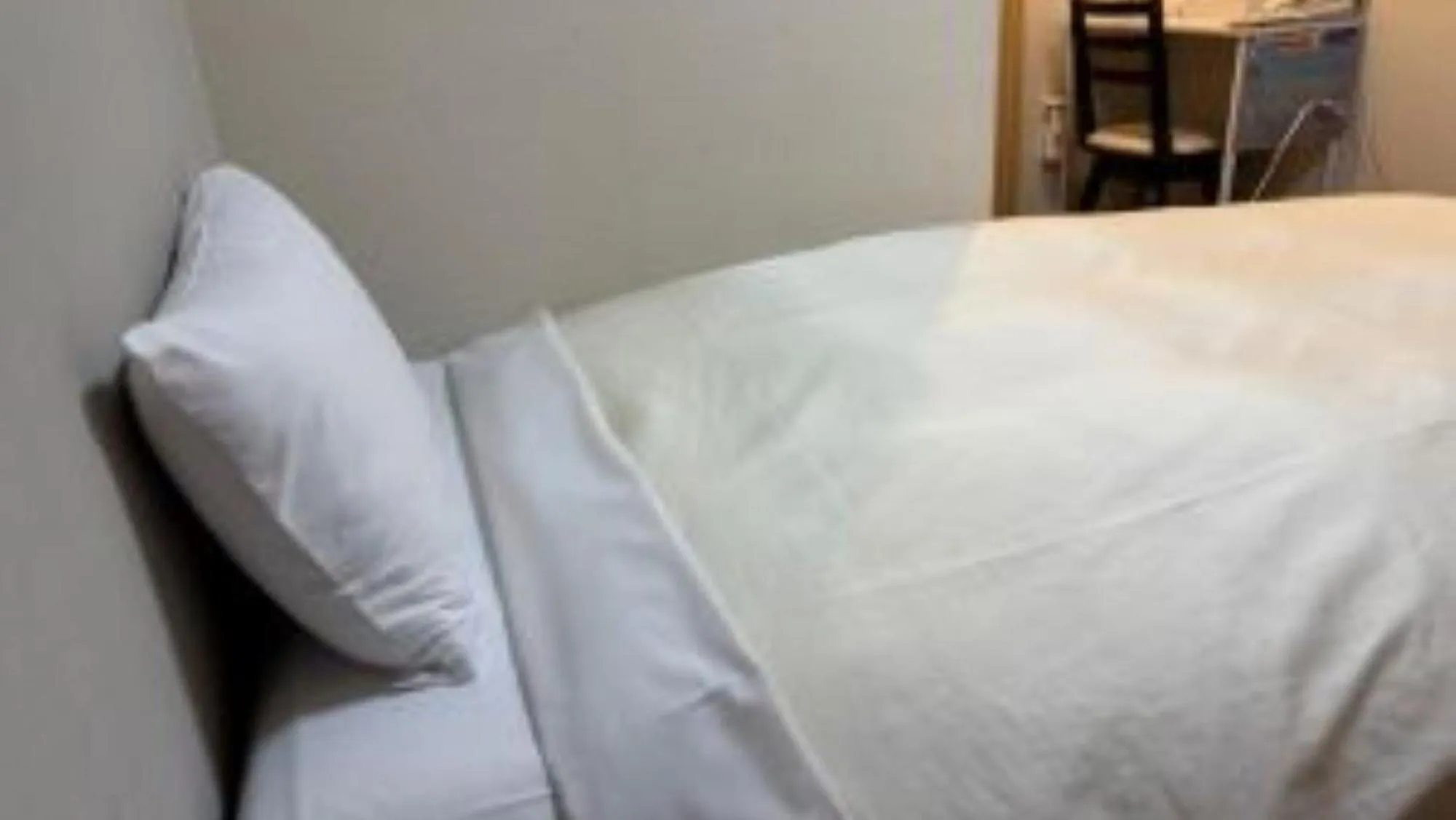 Bed in Hotel Niihama Hills Prince House