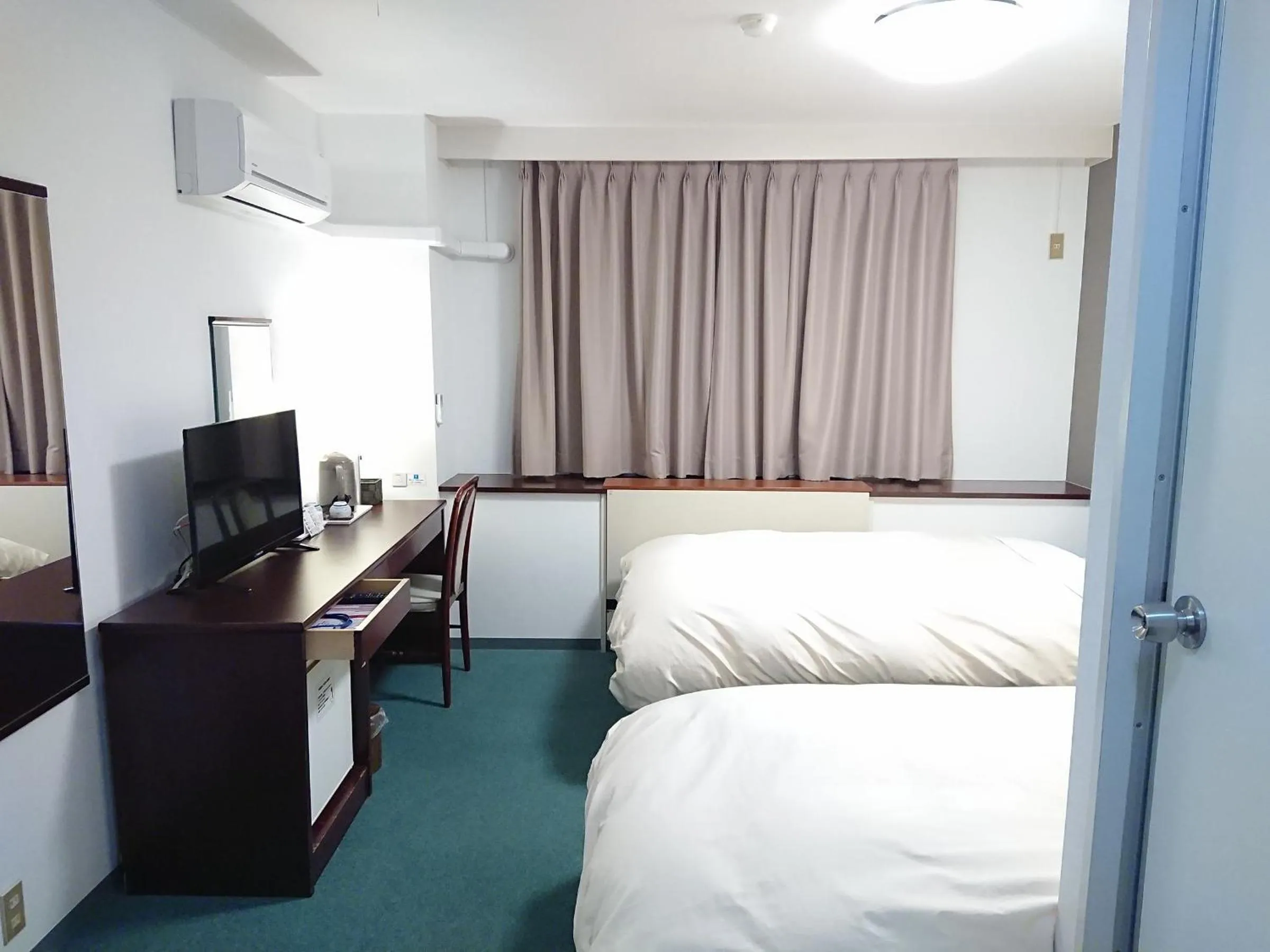 Photo of the whole room, Bed in Hotel Crown Hills Imabari