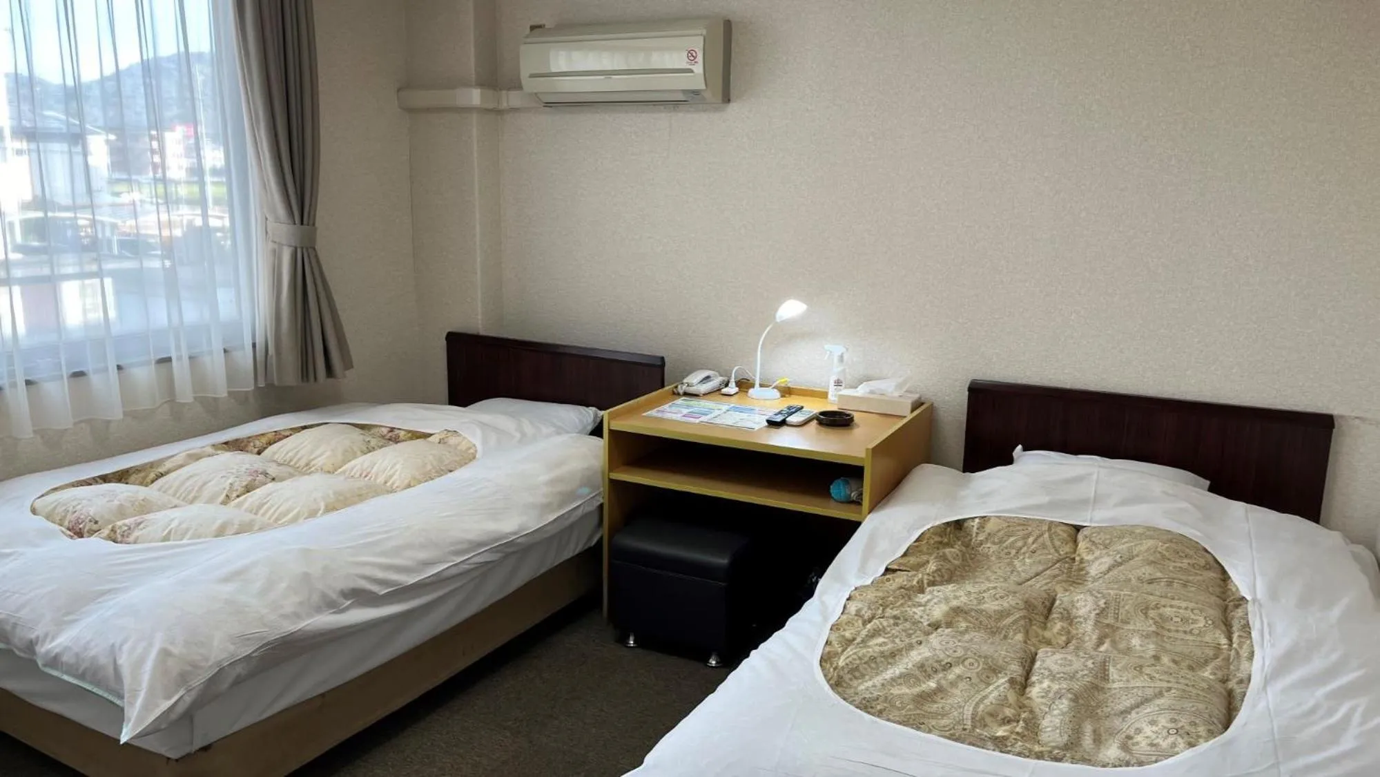 Bed in Hotel Higashihiroshima Hills Saijo