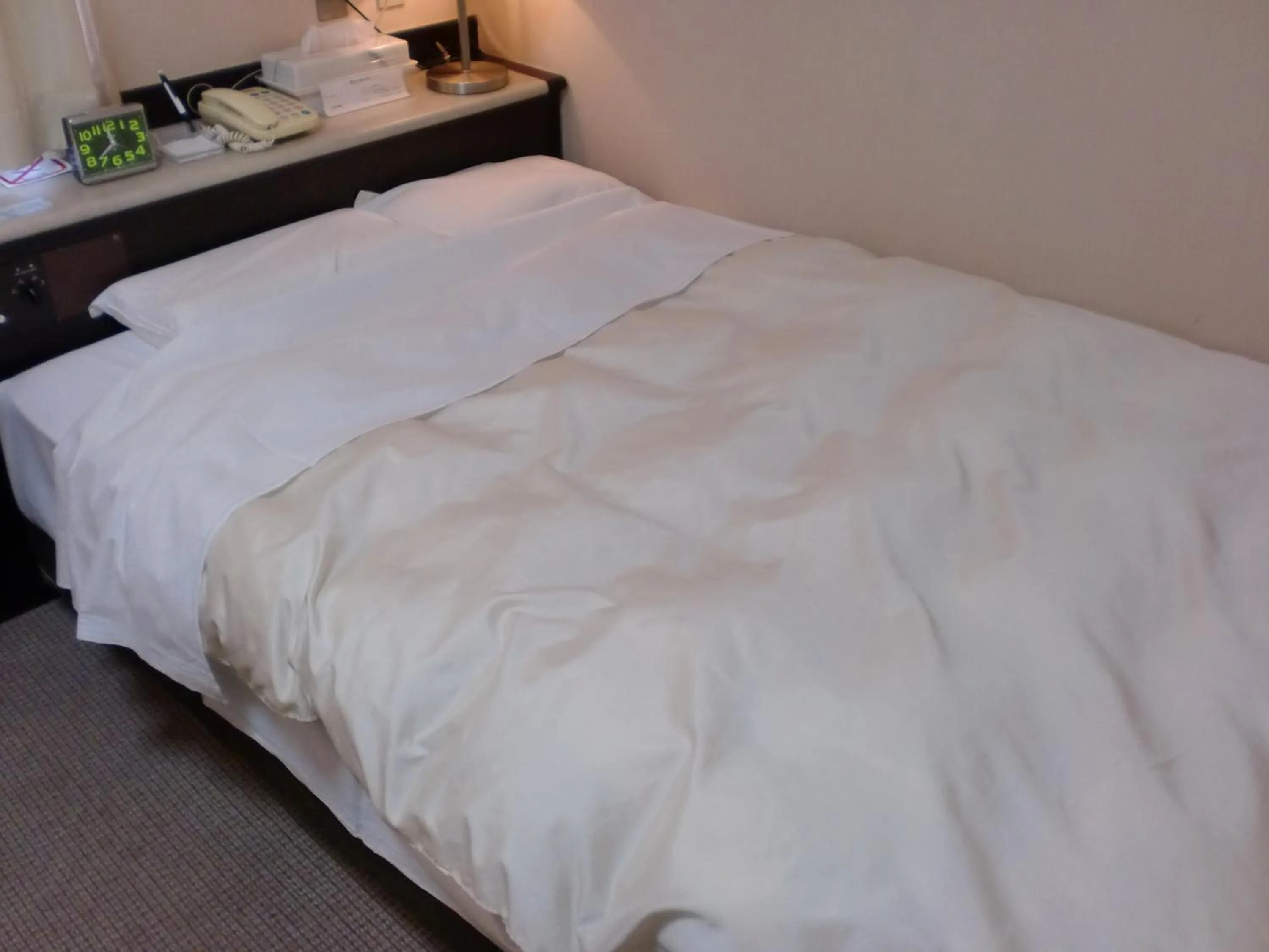 Bed in Tsuyama Central Hotel Townhouse