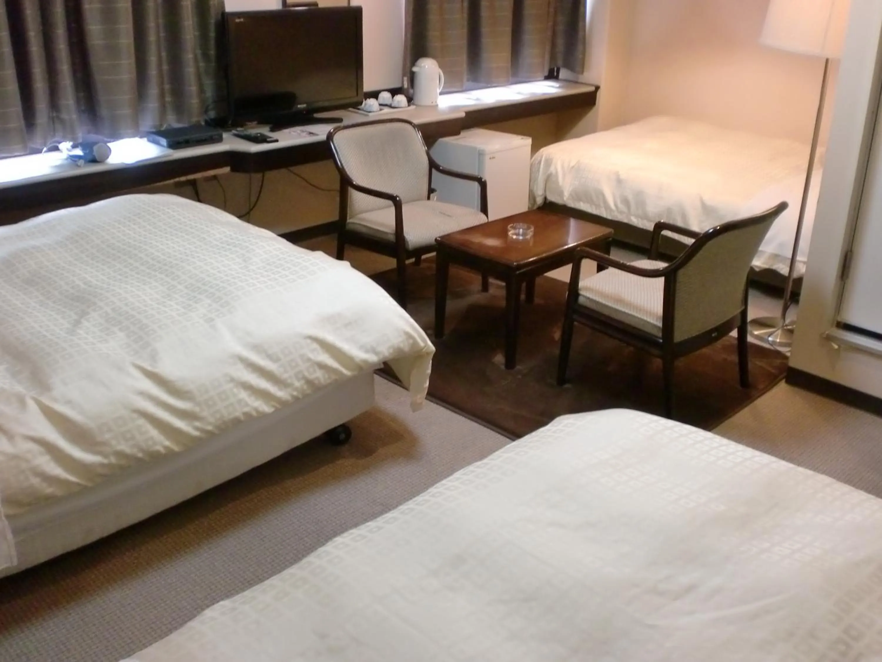 Bed in Tsuyama Central Hotel Townhouse