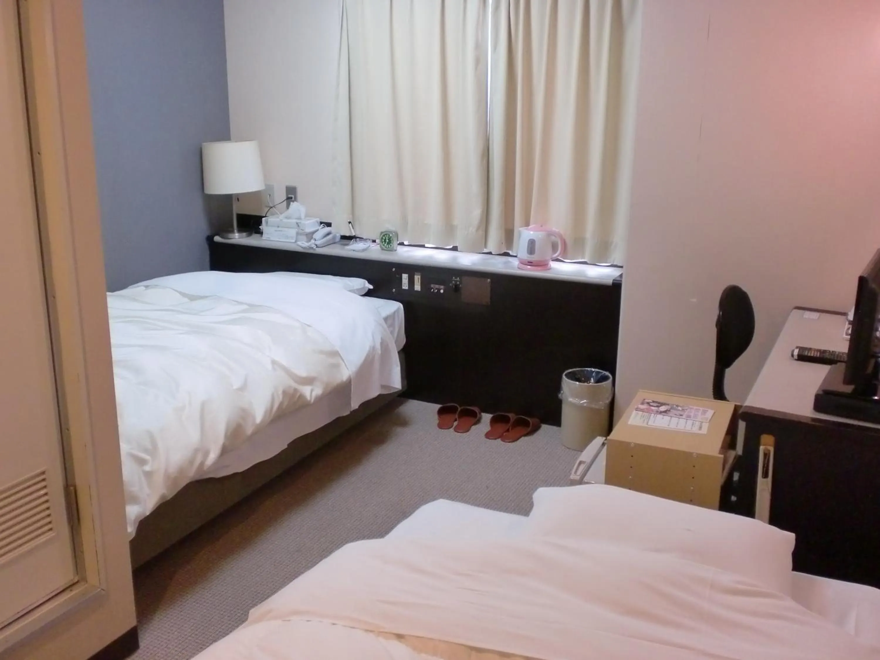 Bed in Tsuyama Central Hotel Townhouse