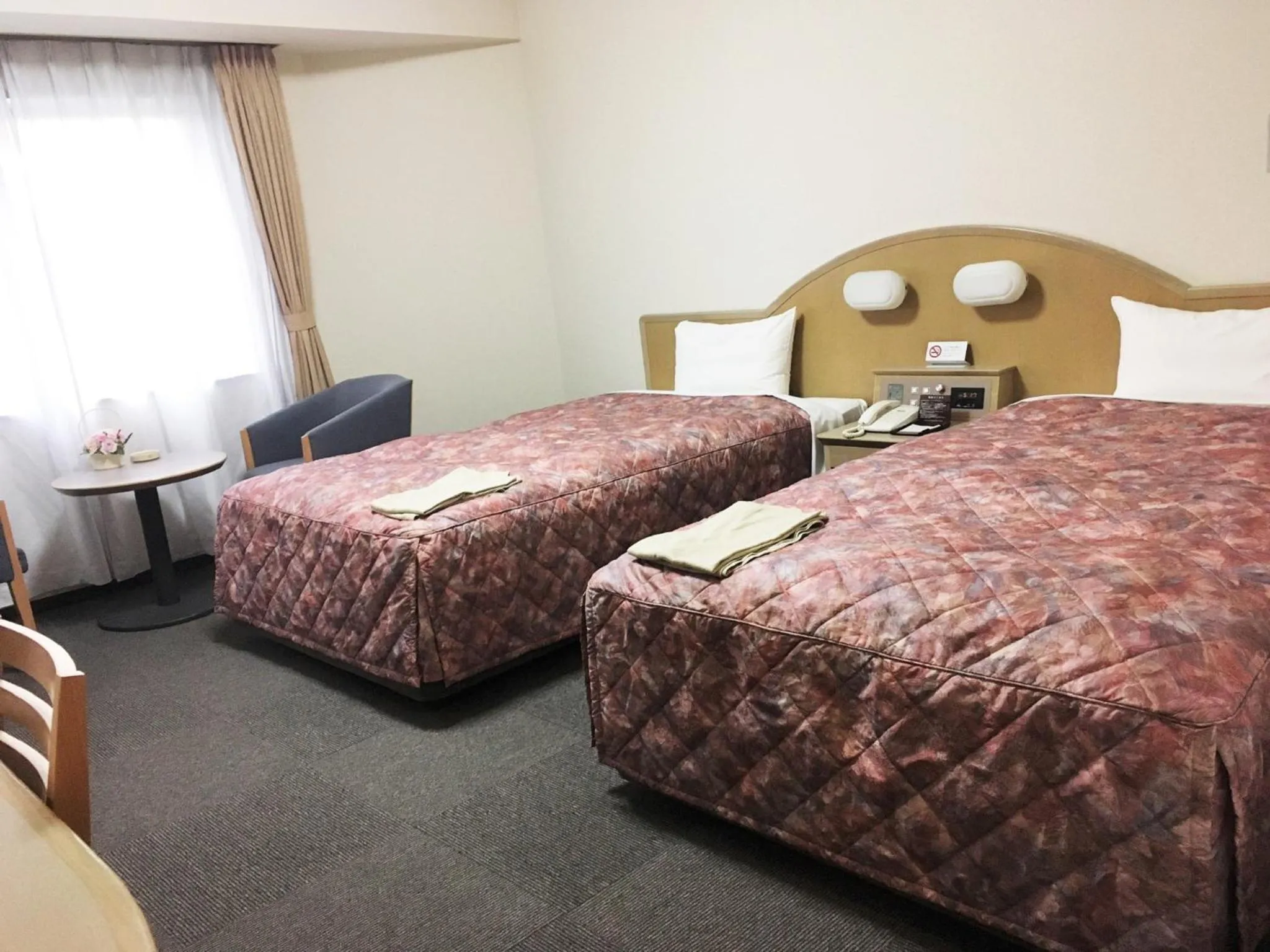 Bed in Oustat Kokusai Hotel Tajimi