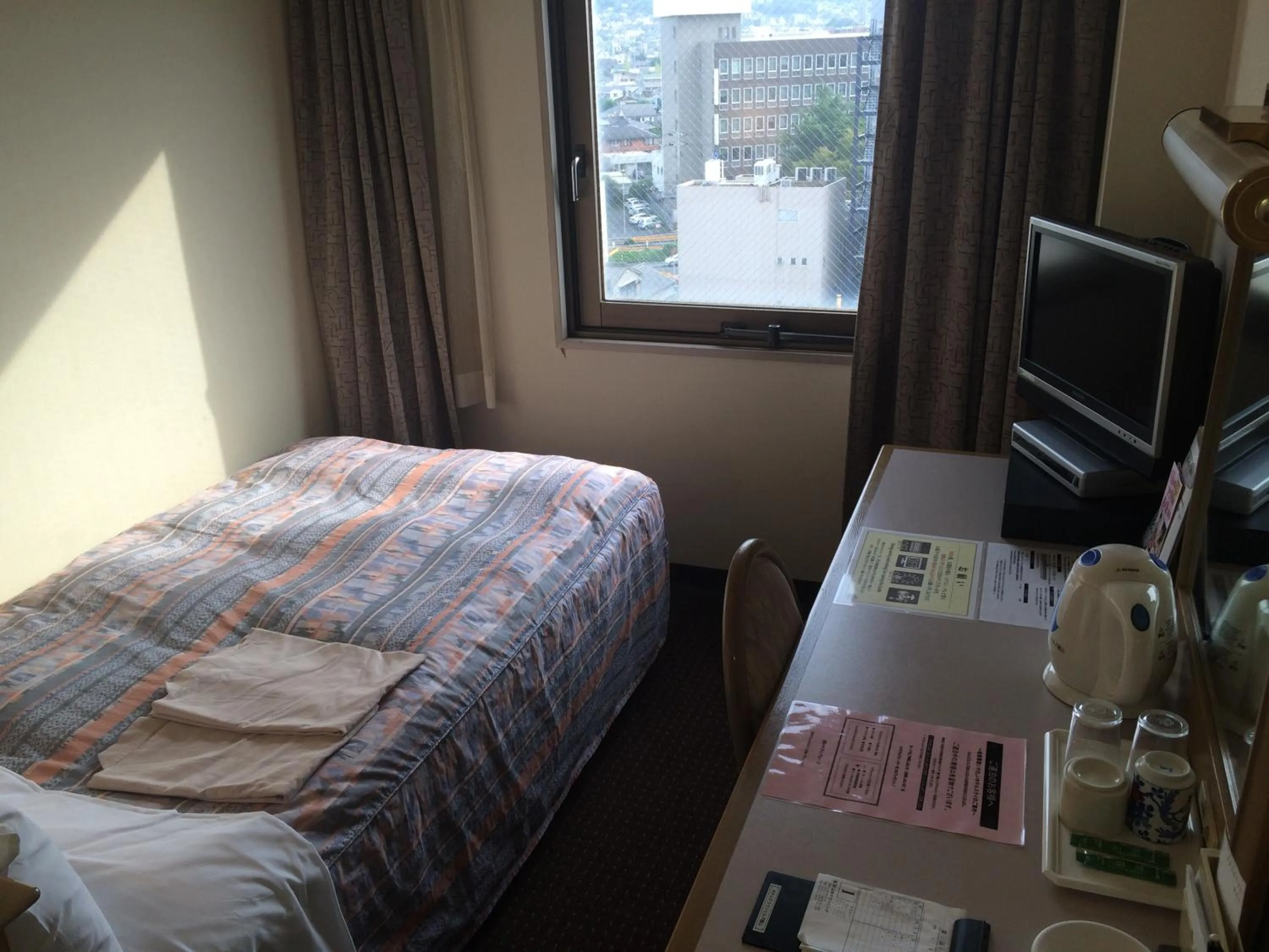 Photo of the whole room, Bed in Hotel Crown Hills Tokuyama