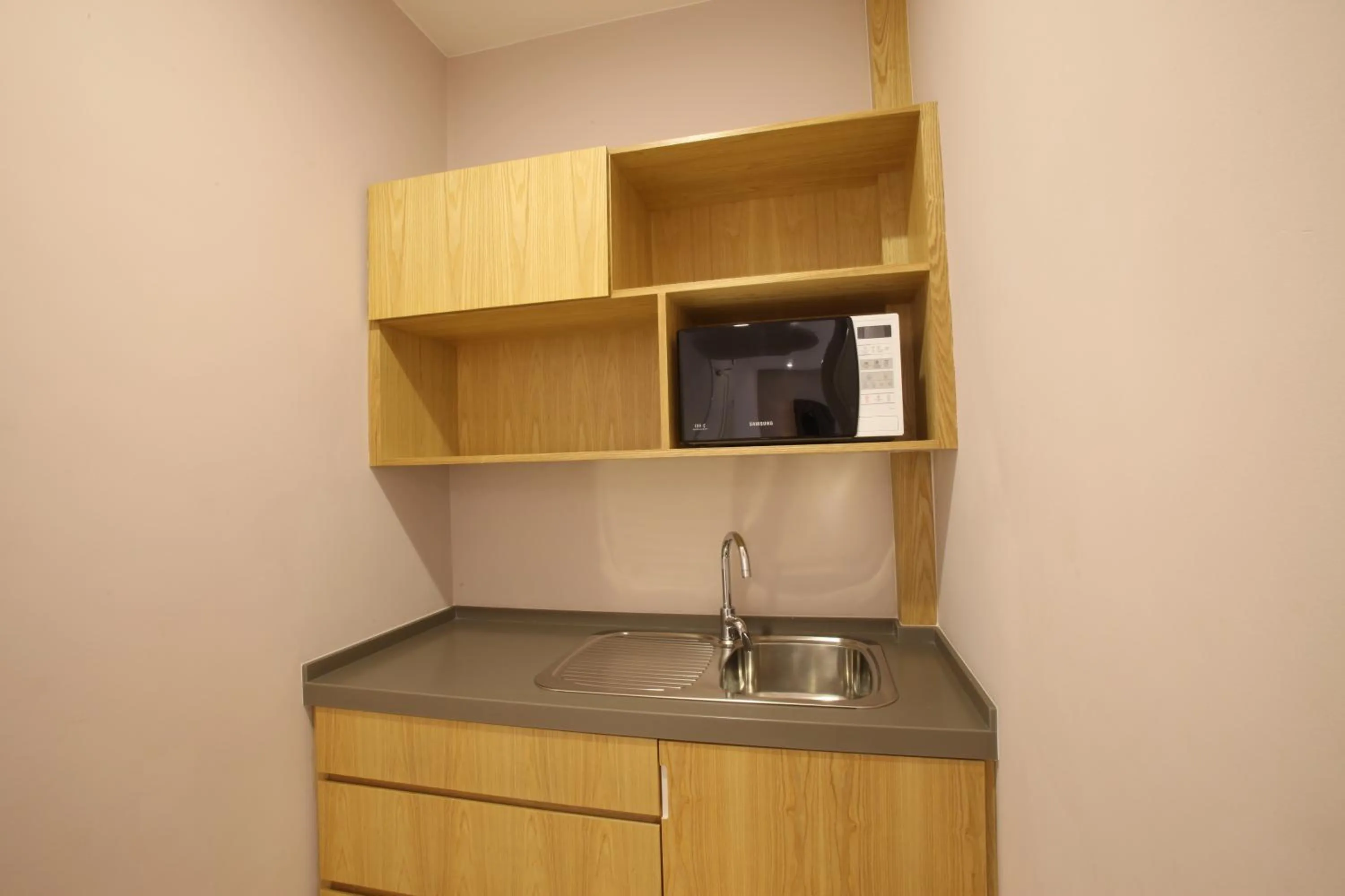 Kitchen or kitchenette in D'Anggerek Serviced Apartment