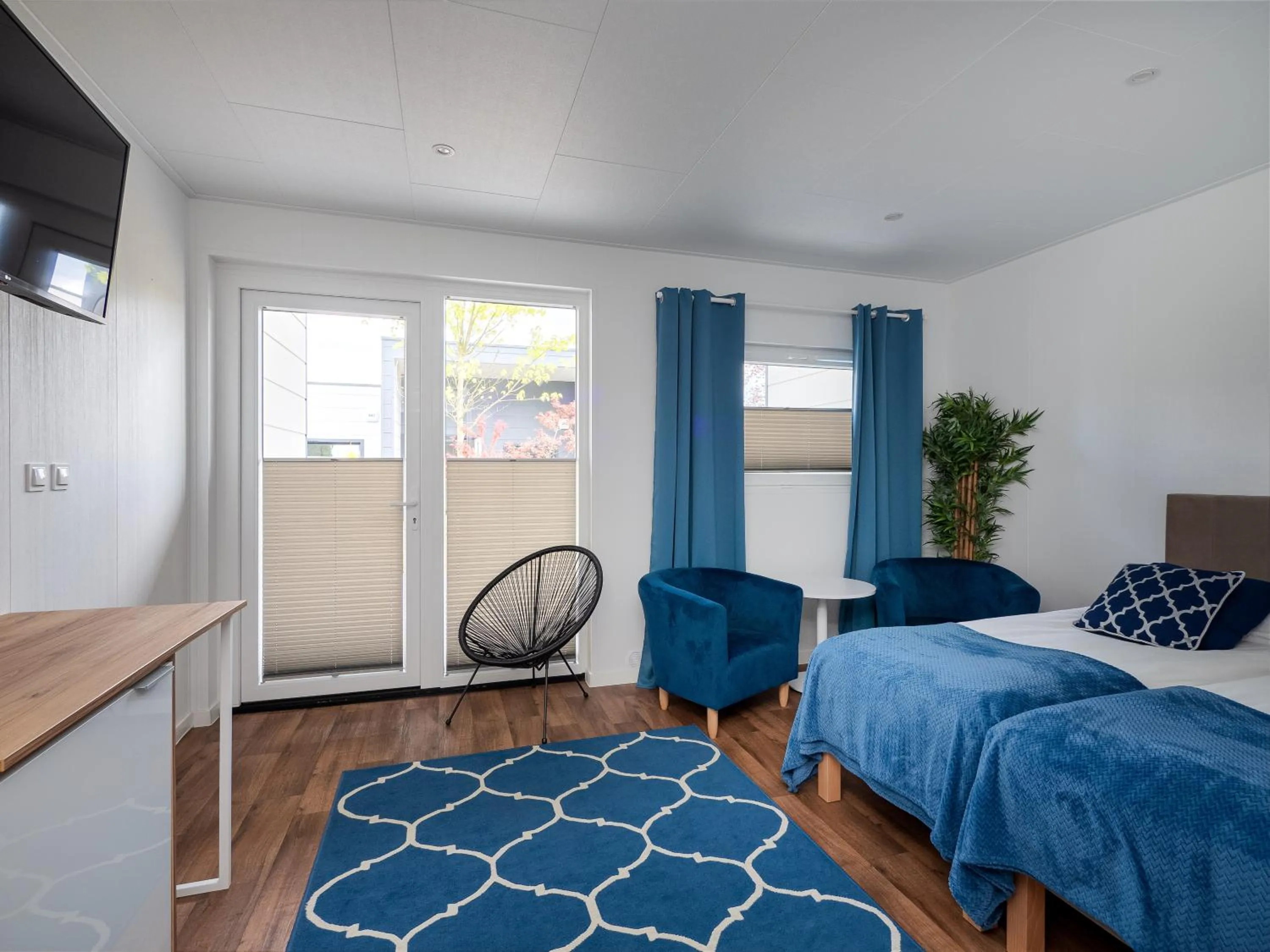 Seating area, Bed in Holiday Golden Resort & Spa
