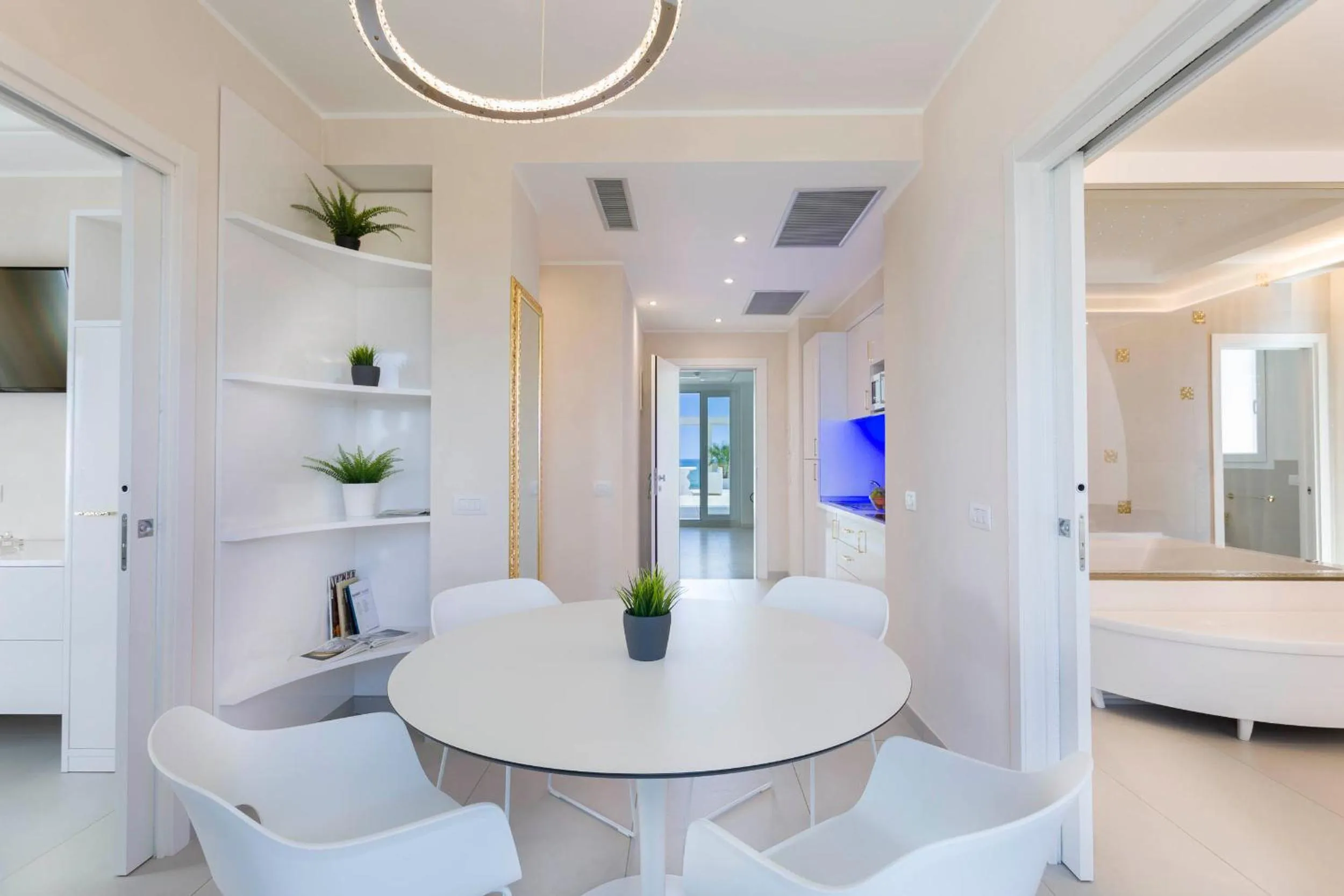 Bed in White Suite & Apartments