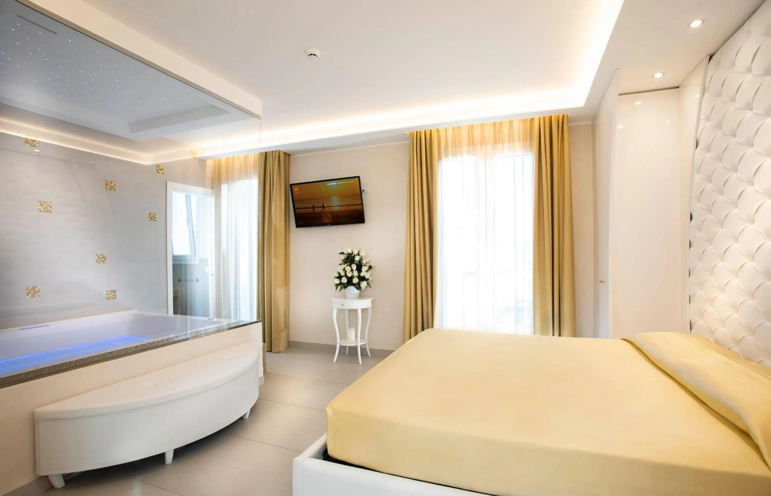 Bed in White Suite & Apartments