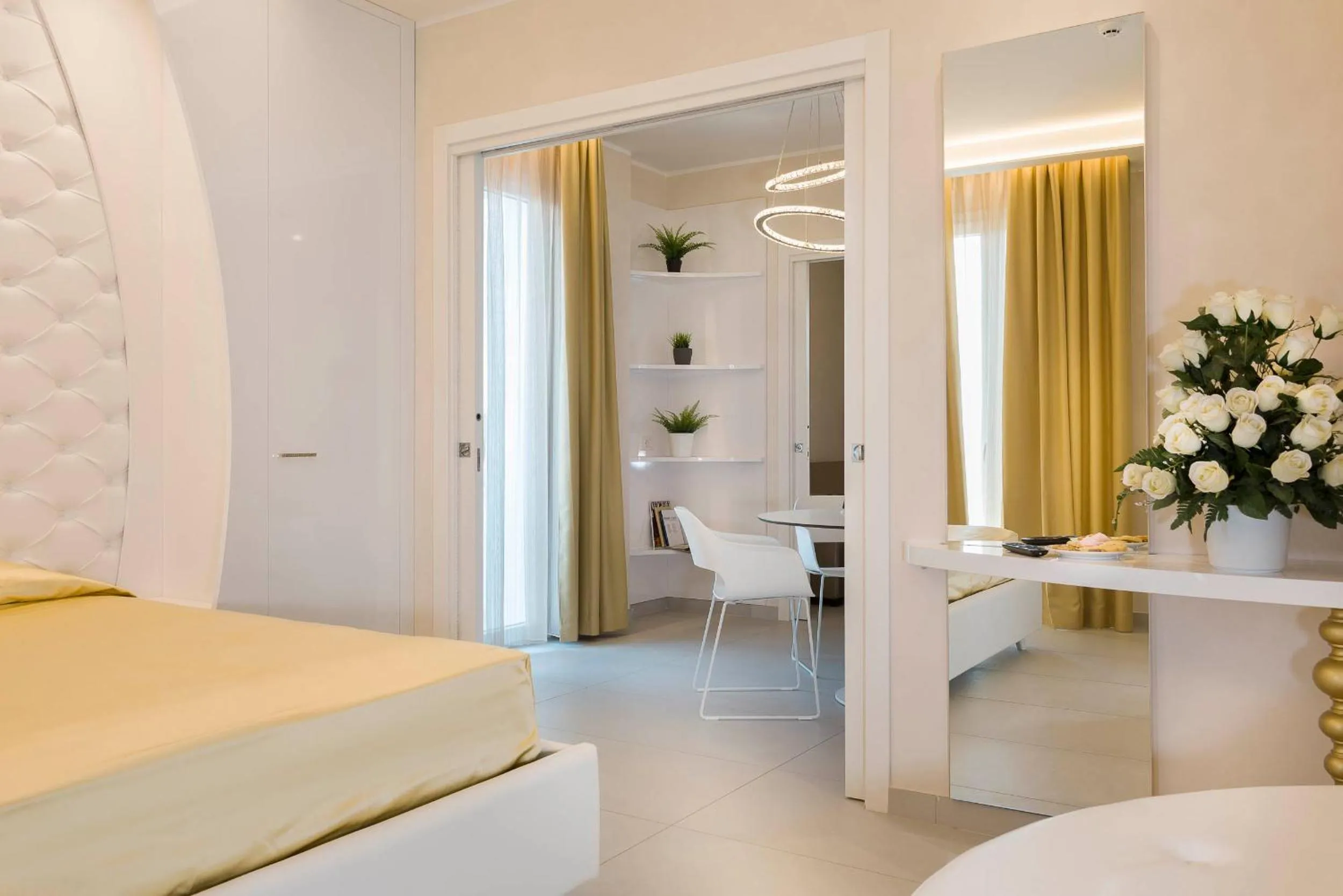 Bed in White Suite & Apartments