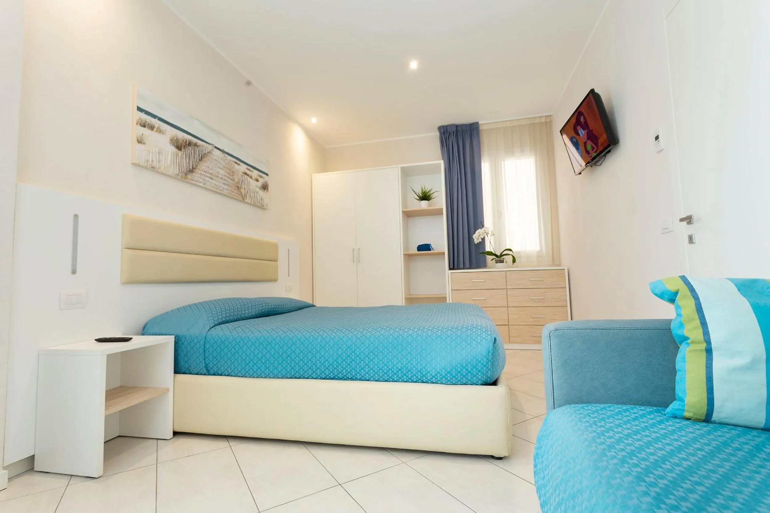 Bed in White Suite & Apartments