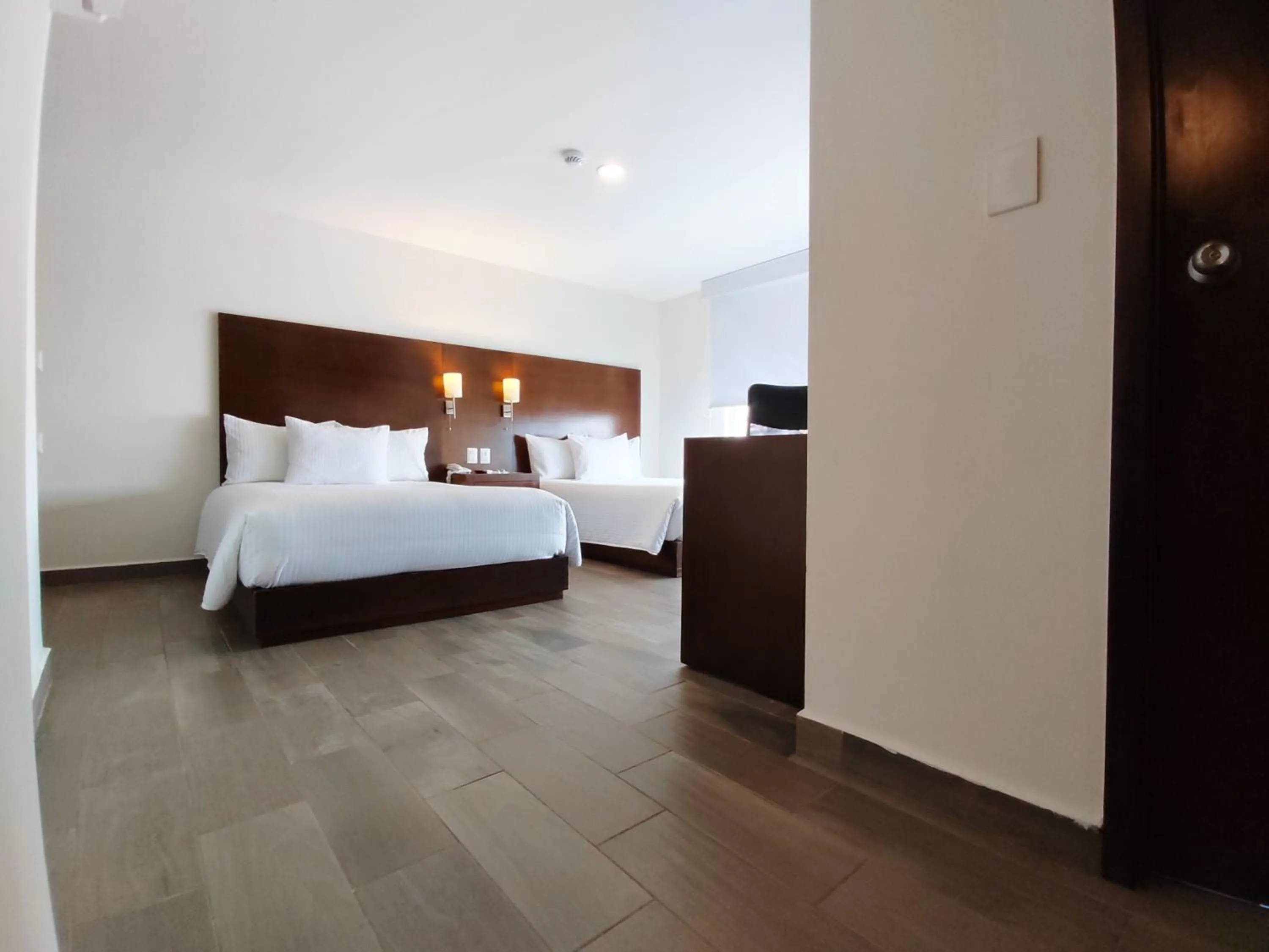Photo of the whole room, Bed in Ramada by Wyndham Tampico Centro