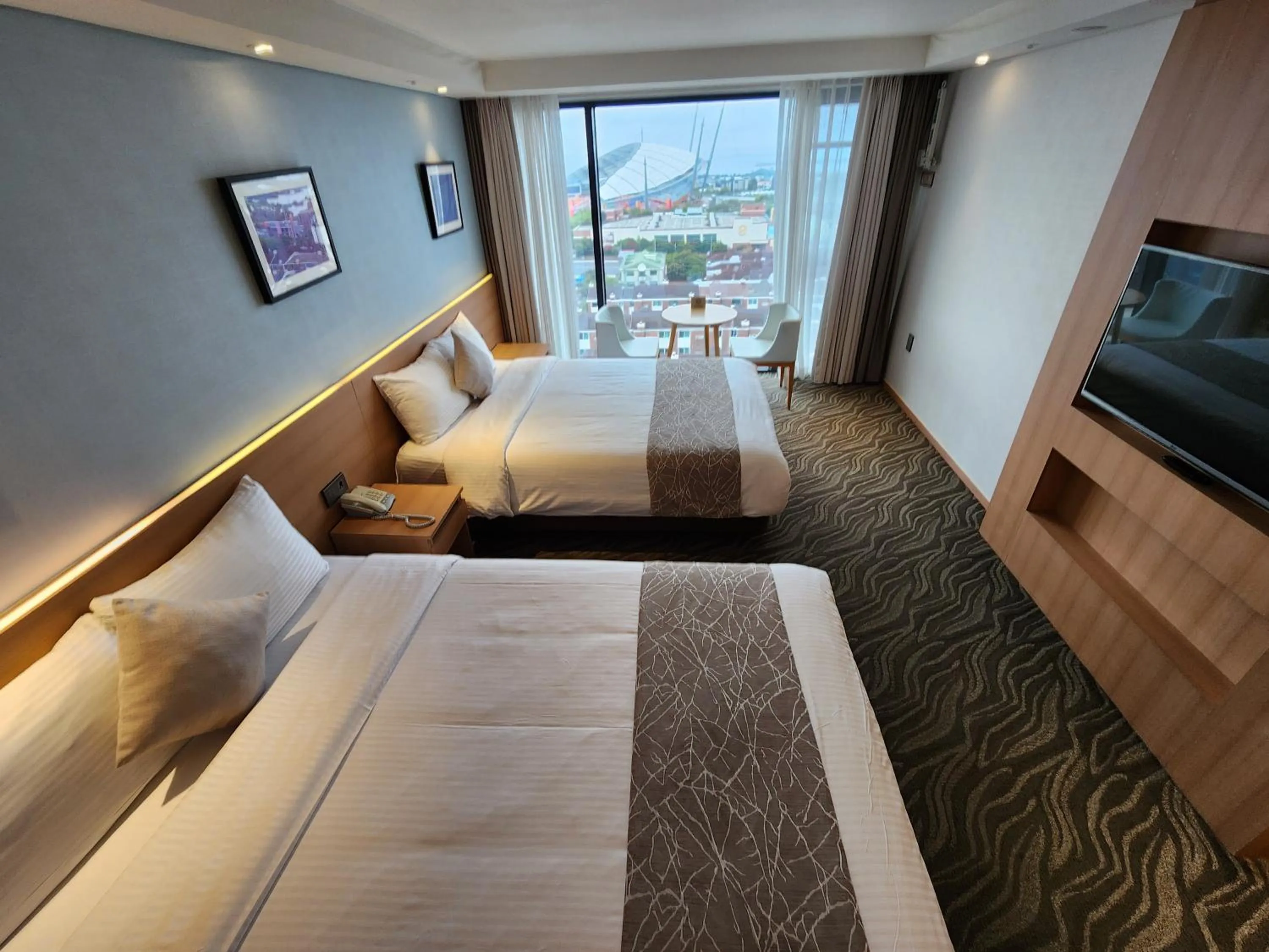 Bed in Seogwipo JS Hotel