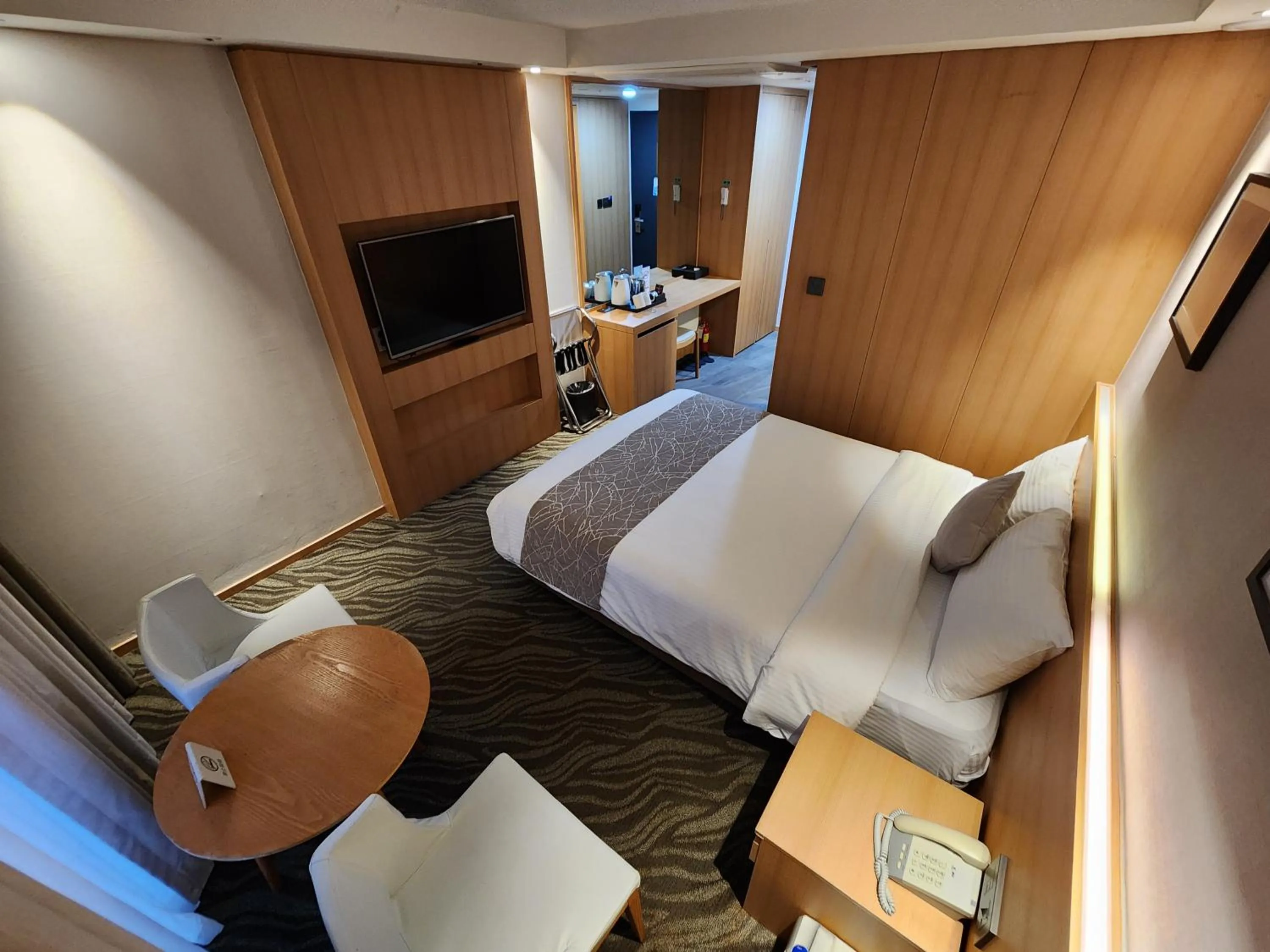 Bed in Seogwipo JS Hotel