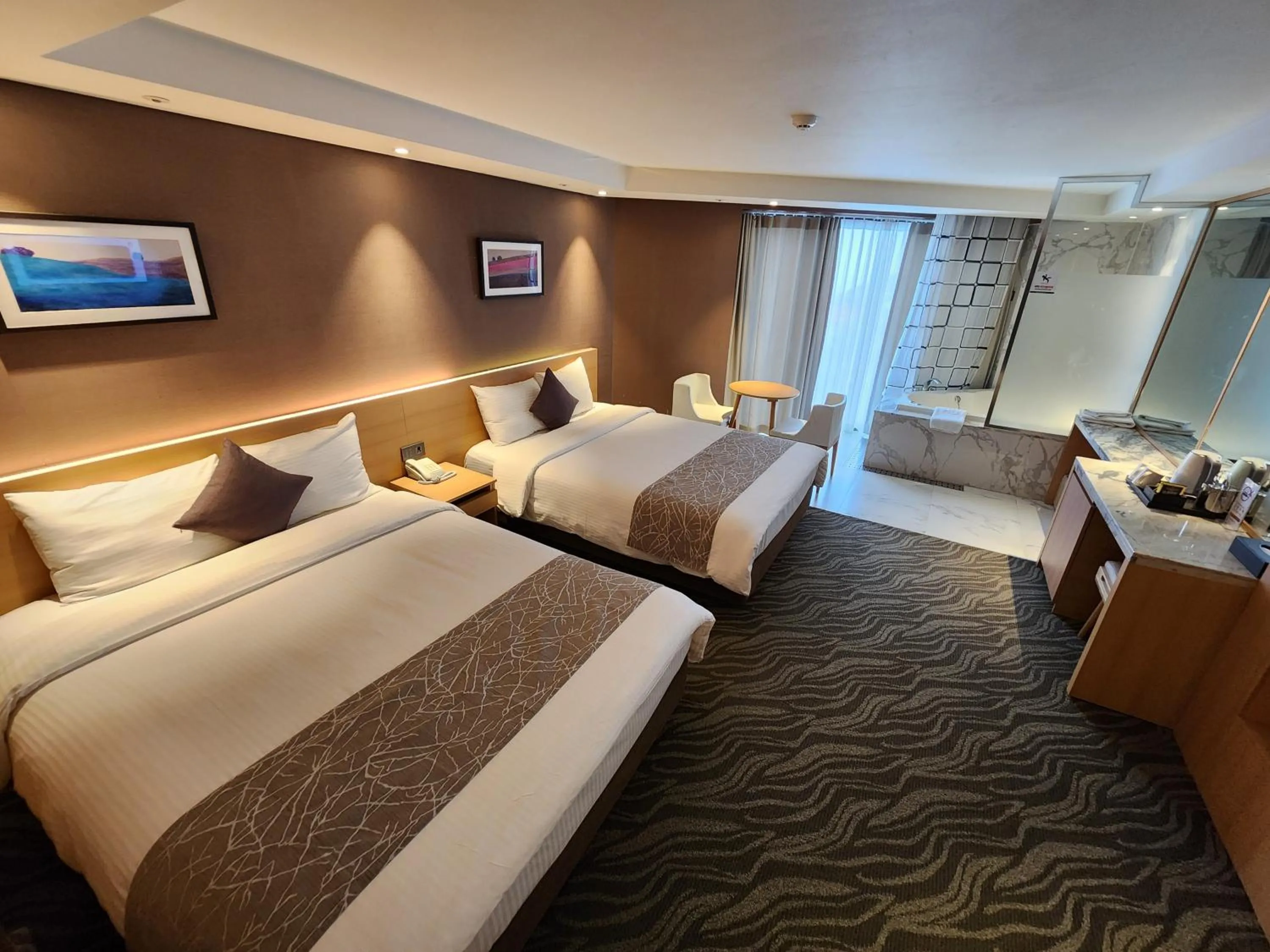 Bed in Seogwipo JS Hotel