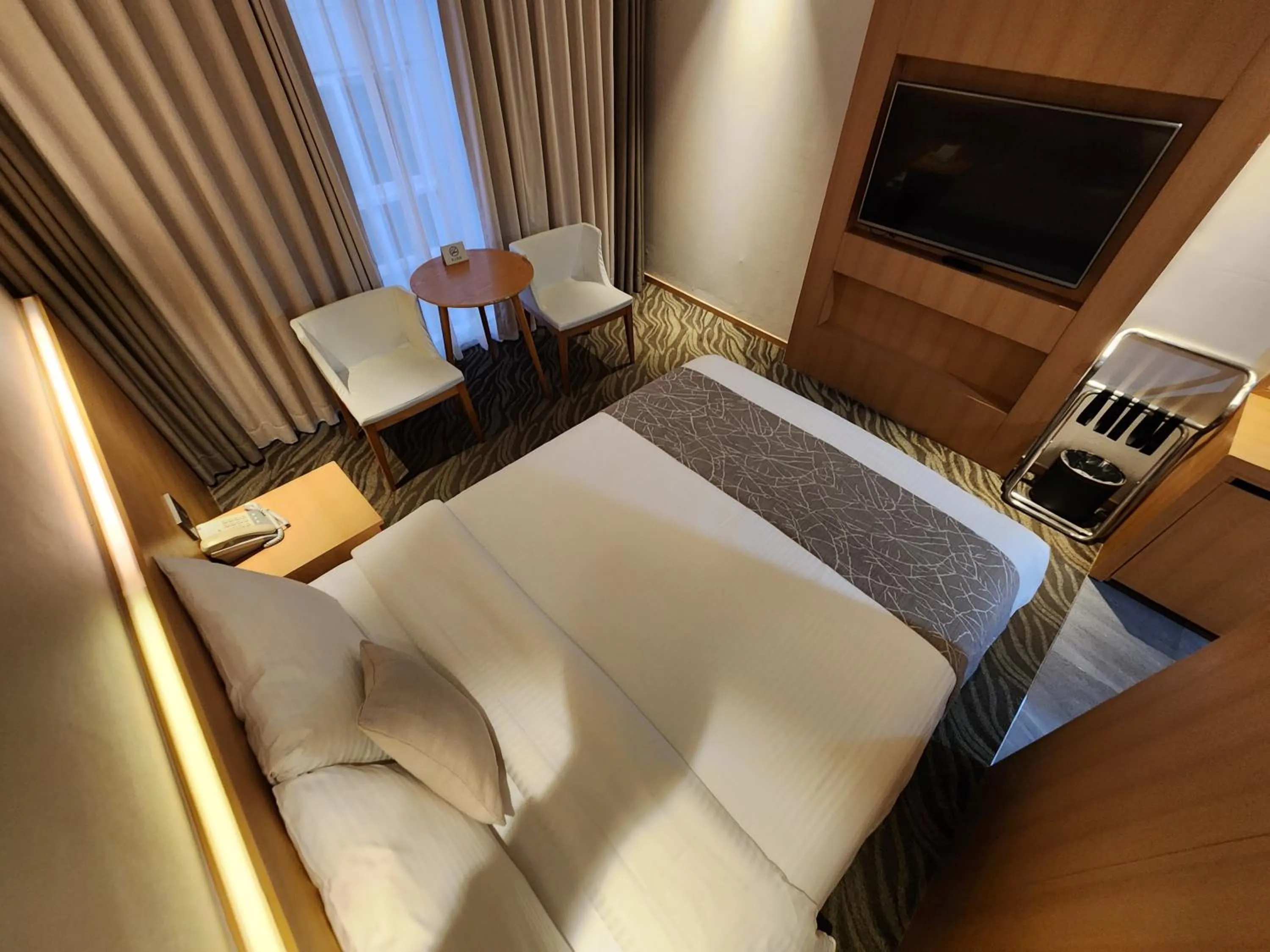 Bed in Seogwipo JS Hotel