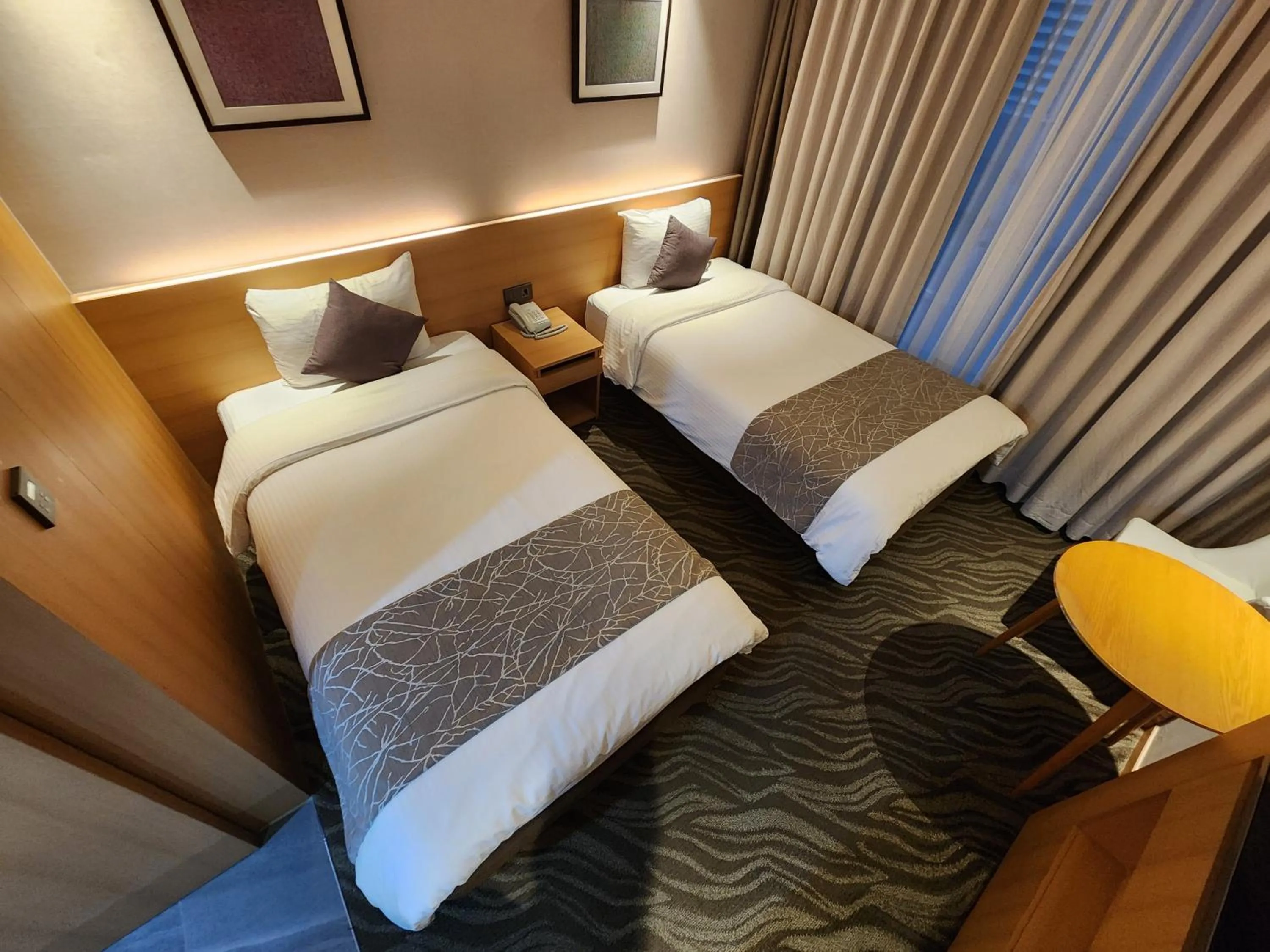 Bed in Seogwipo JS Hotel