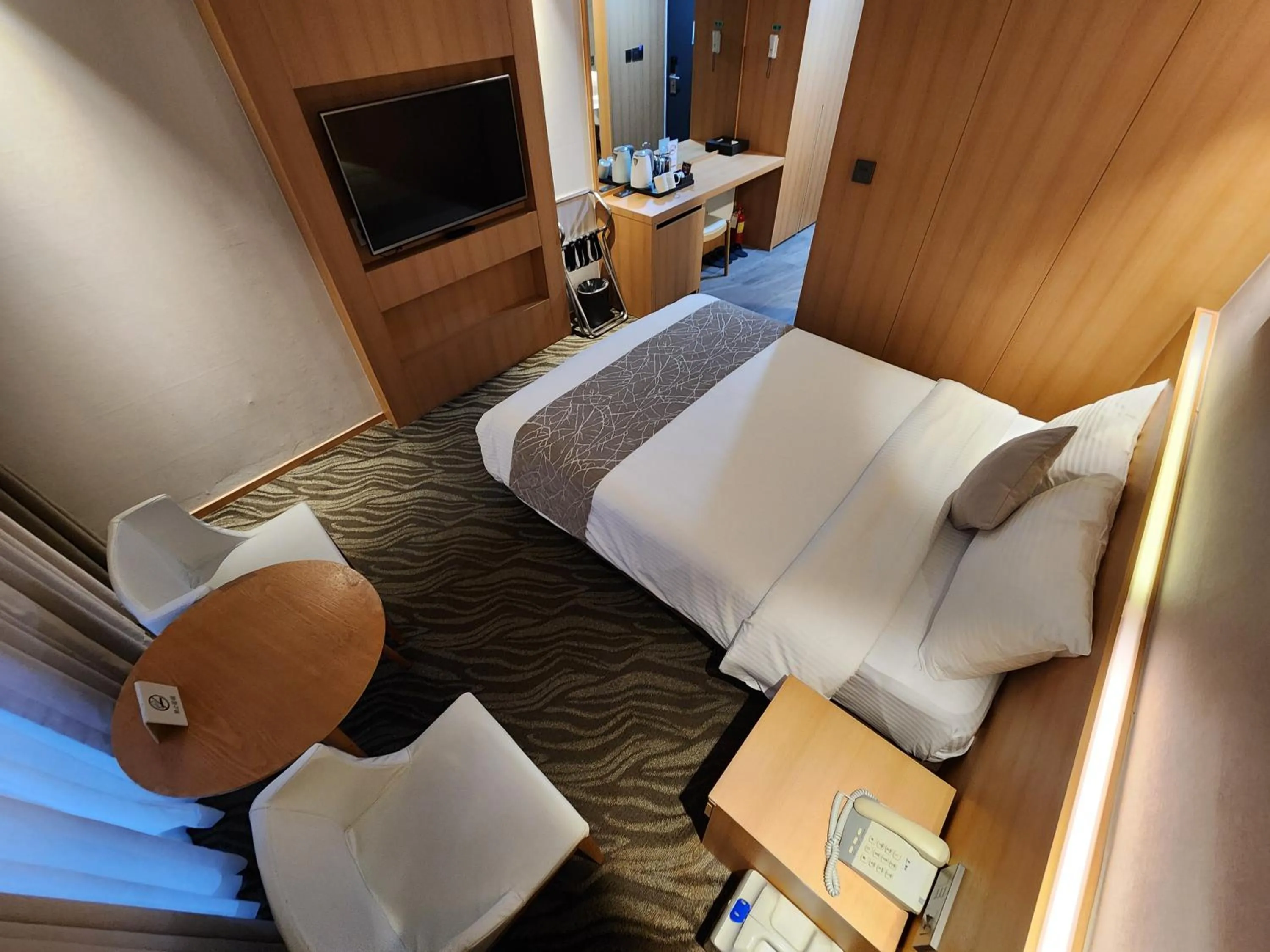 Bed in Seogwipo JS Hotel