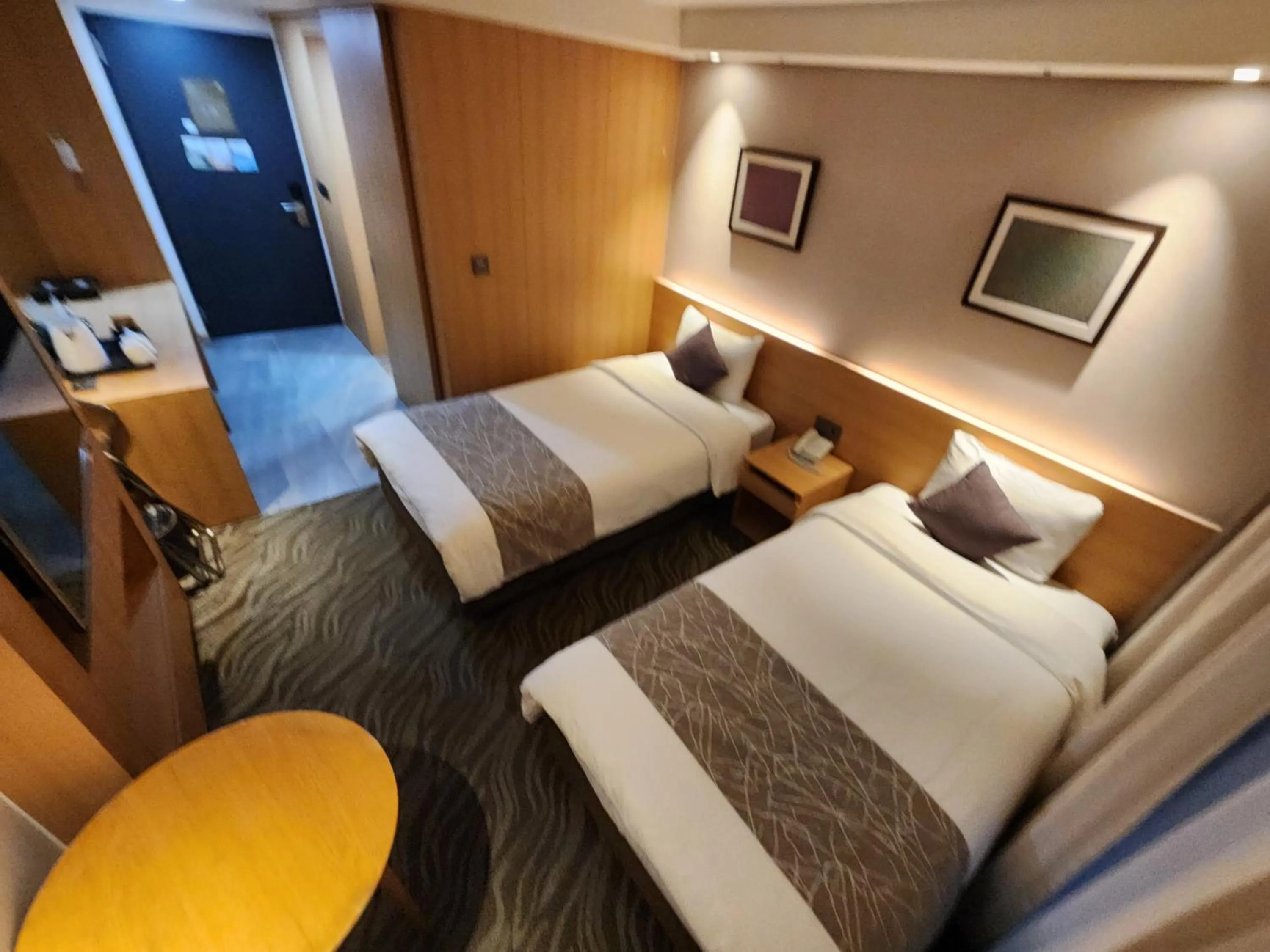 Bed in Seogwipo JS Hotel