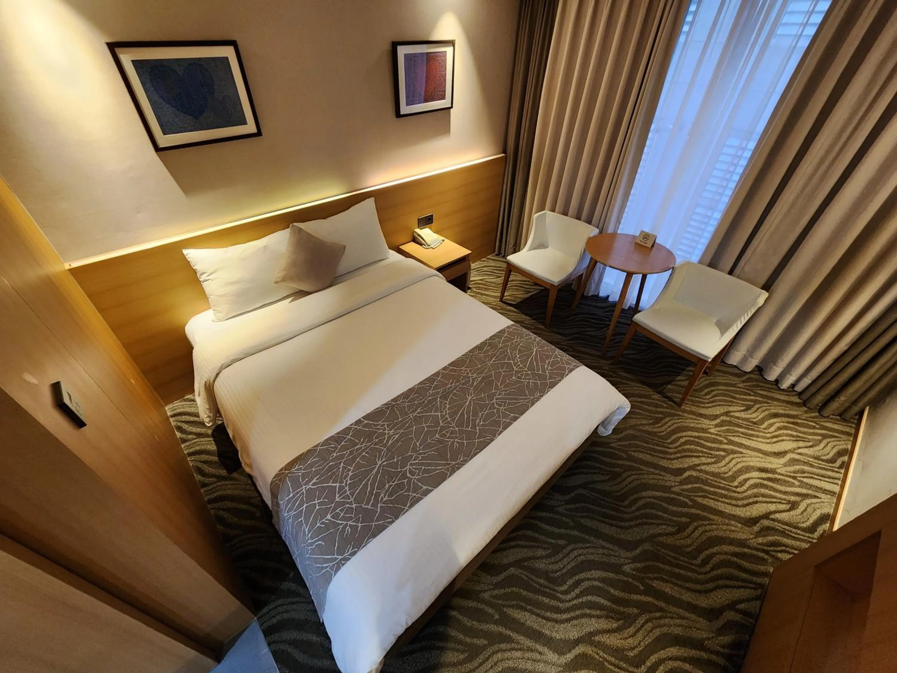 Bed in Seogwipo JS Hotel